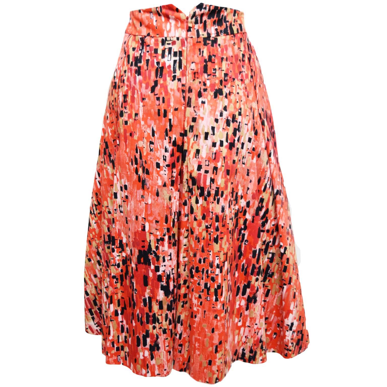 This Carolina Herrera  piece is a great statement to have in your closet. The skirt is a abstract printed skirt and is 100% cotton. The lining is a soft silk taffeta to give is a nice body and shape. Knife pleats and back zip closure. 
