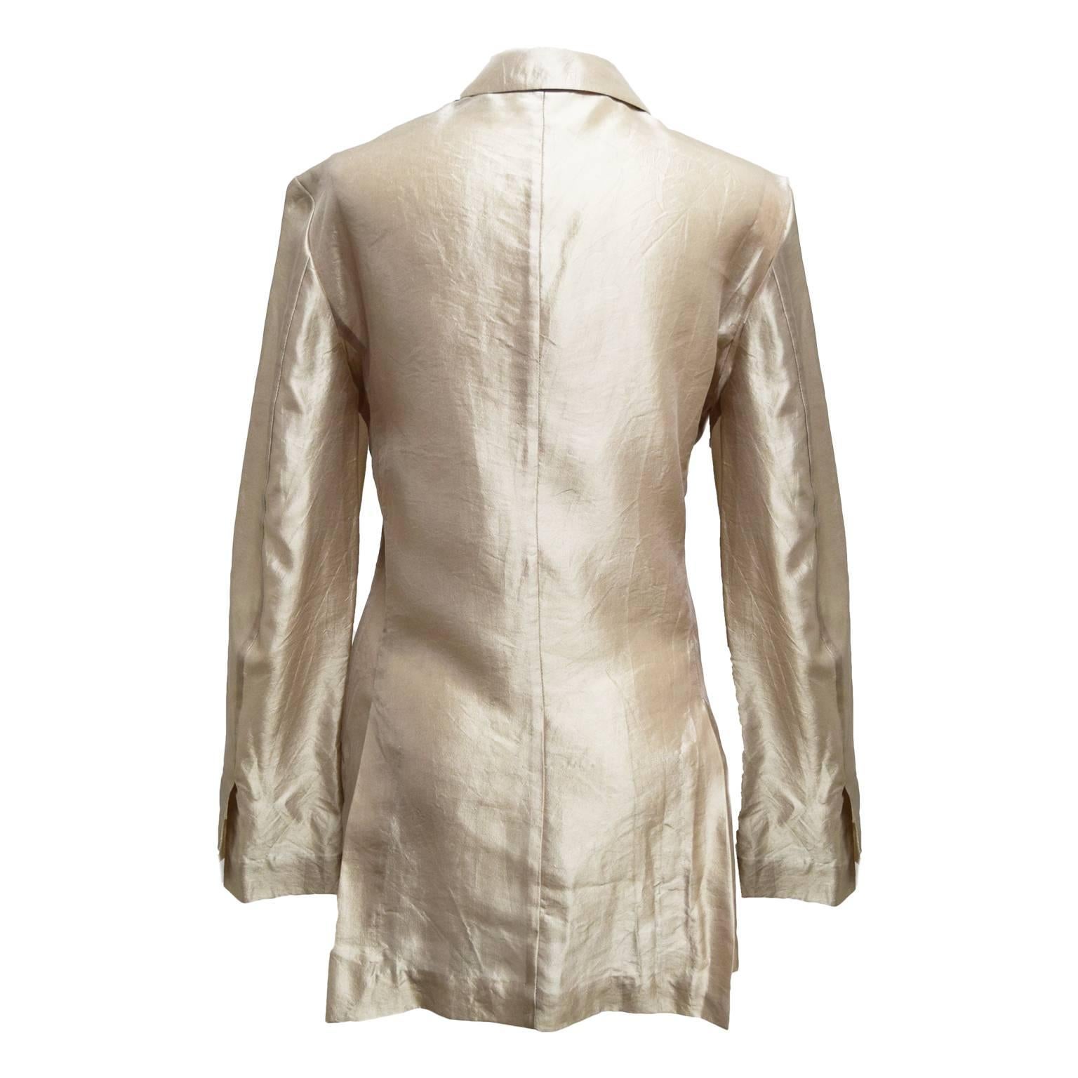 This great jacket by Haider Ackerman is a champagne crinkled silk, it is a open jacket with side pockets and very light. This jacket is good for pairing with a cocktail dress or a light blouse and pants
