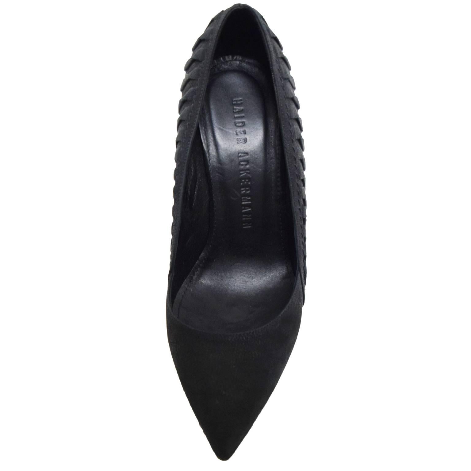 These Haider Ackerman pumps are matte leather and have side twisted leather creating a ribbed like side detail. The heel size is 4.5