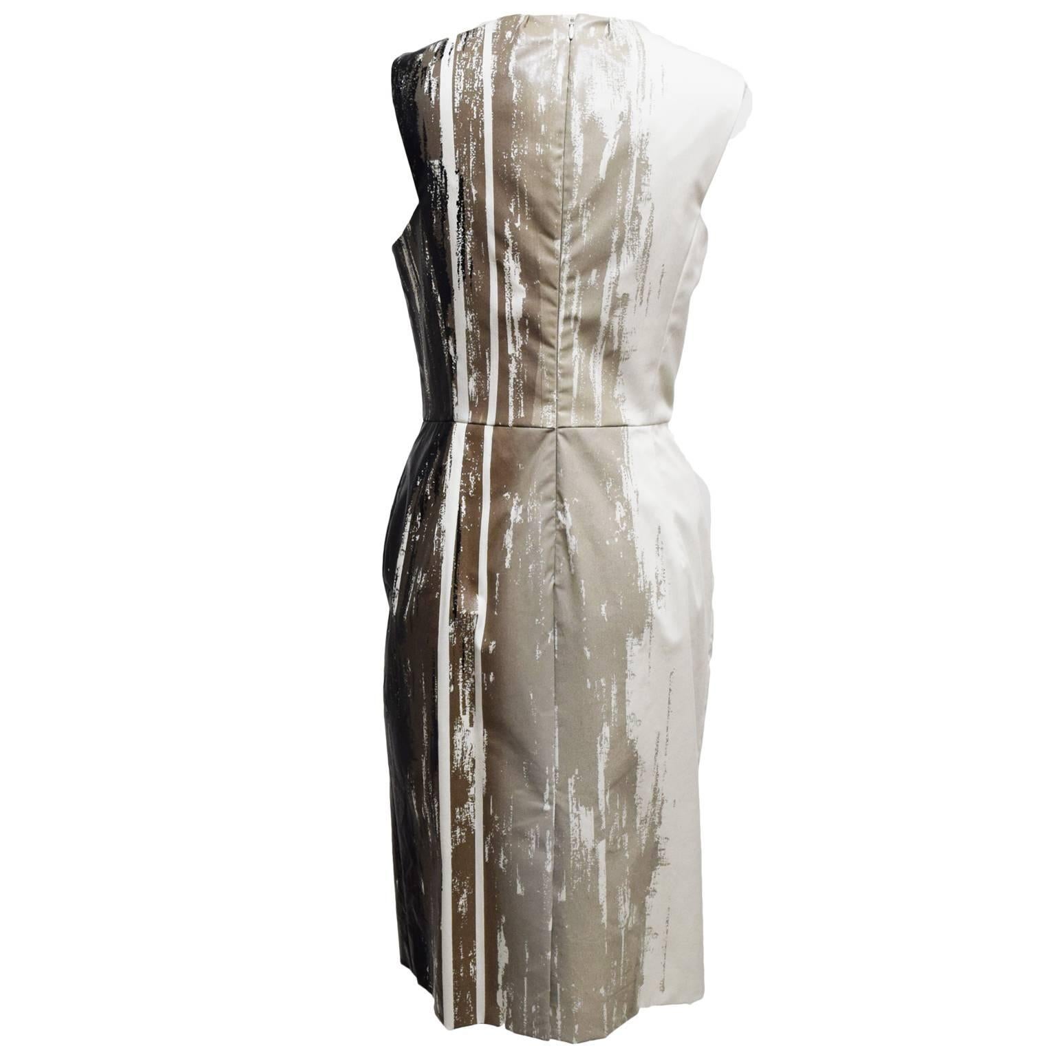 This one of a kind dress by Jason Wu is a cotton, spandex blend and is fully lined in silk. The dress has abstract painted stripe details with a high waistline and a frontal panel. 