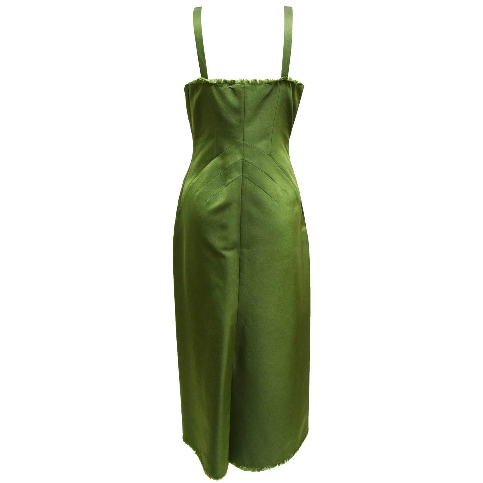 This Alberta Ferretti cocktail dress is made of a cotton silk blend and is a rich olive color. The ends of the dress are fringed an the dress has slimming darts down the dress creating an hour glass shape.  