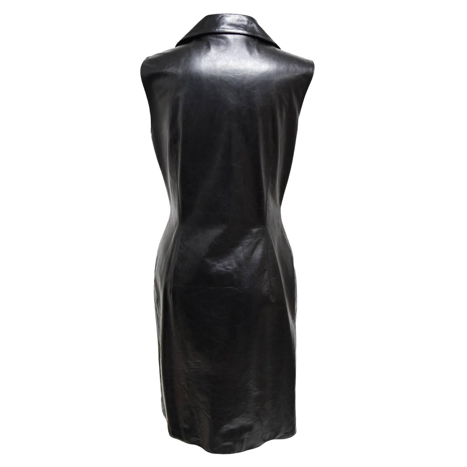 This sexy yet tasteful dress by Oscar de la Renta is made of 100% black leather and is fully lined with silk. The front of the dress is a button down with tortious shell buttons. The dress is sleeveless, has front pockets, and a collared finish.   