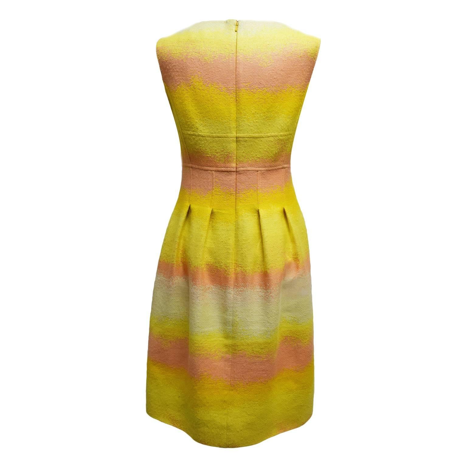 This dress by Lela Rose is a great summer dress. Made of wool the dress has a yellow and coral ombre print, and is fully lined. The back is a zipped back, while the skirt has knife pleats and the neckline is a deep-v. 