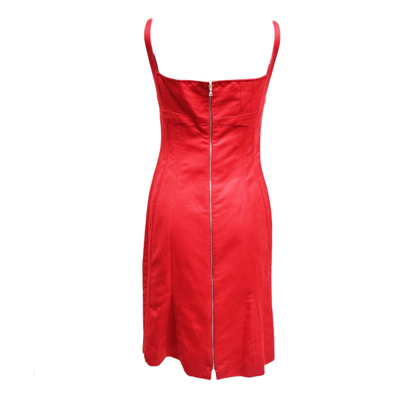 This beautiful, simplistic dress by Narciso Rodriguez is made of 100% red cotton. The silhouette is a sheath dress, and the back has a back slit. The Dress has a back zipped closure.  