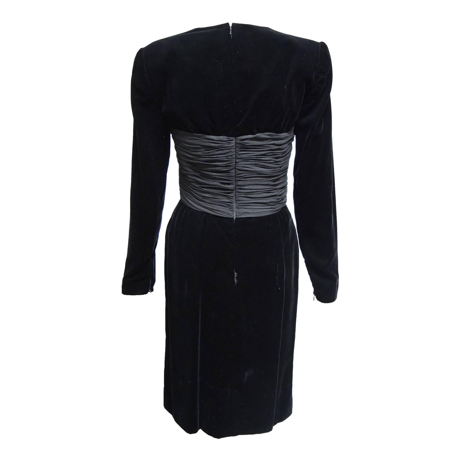 This beautiful dress by Oscar da la Renta is a silk and velvet blend. The dress is fully lined and has a back zipped closure. The bodice has silk crepe draped creating an asymmetrical look and continues in the back.   