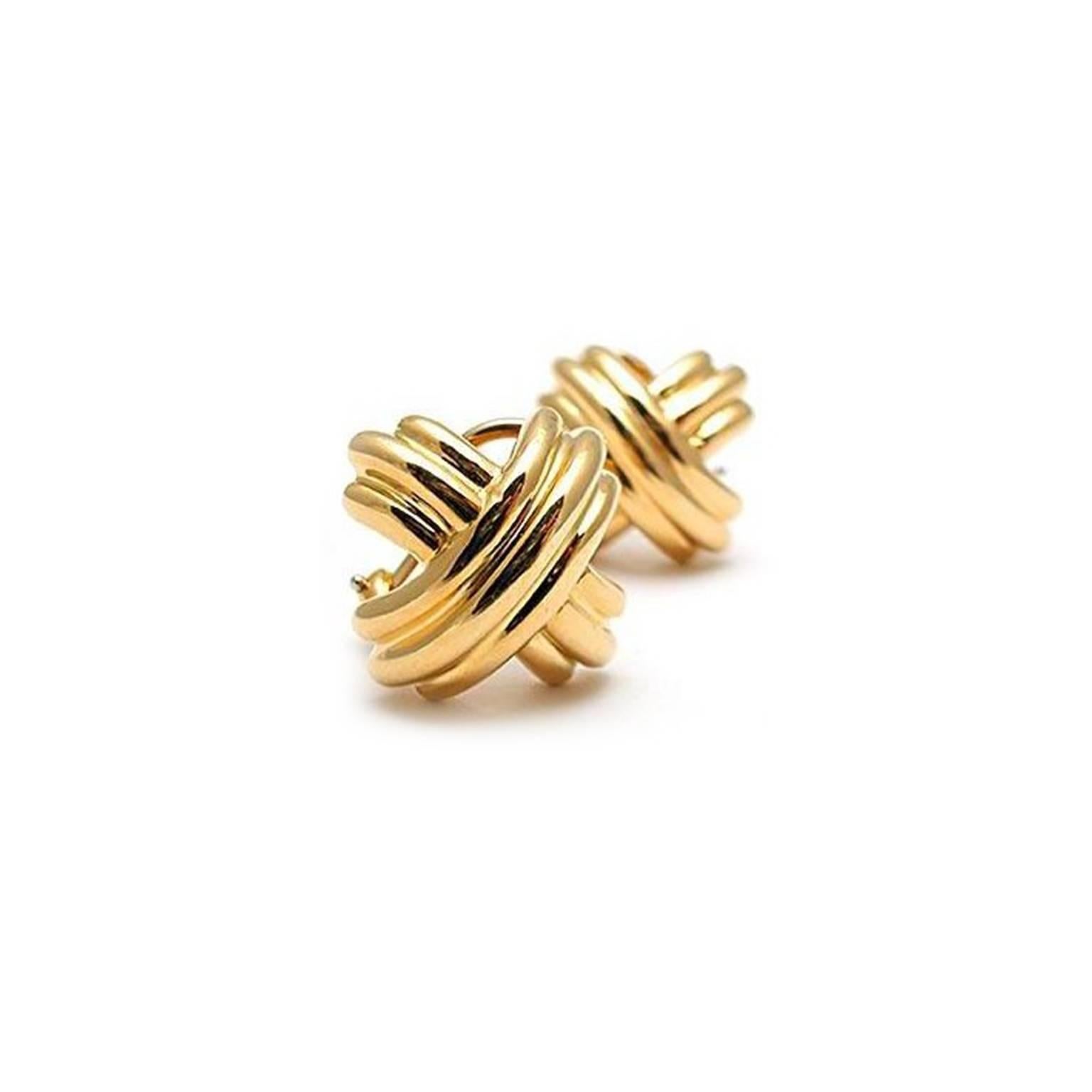 Beautiful and classic, Tiffany & Co. 18K yellow gold earrings, omega style clip backs, stamped T & Co., 750. 12.8 grams of weight. These earrings are great for everyday wear or anytime whether is casual or cocktail attire dressing. Excellent