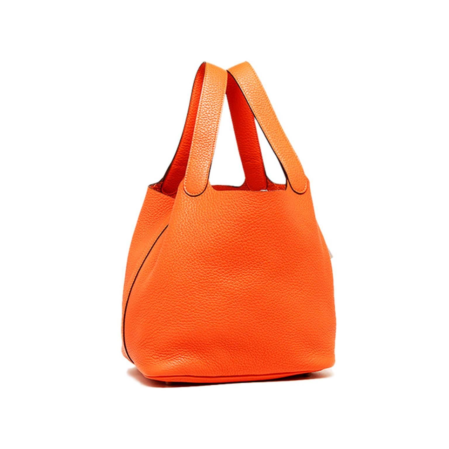 This contemporary Hermes Picotin Mini is a must have to many known Celebrities. With the classic Hermes orange coloration and Clemence Leather, it is a vibrant statement piece and a soft smooth touch to the hand. It is complete with a buckle strap