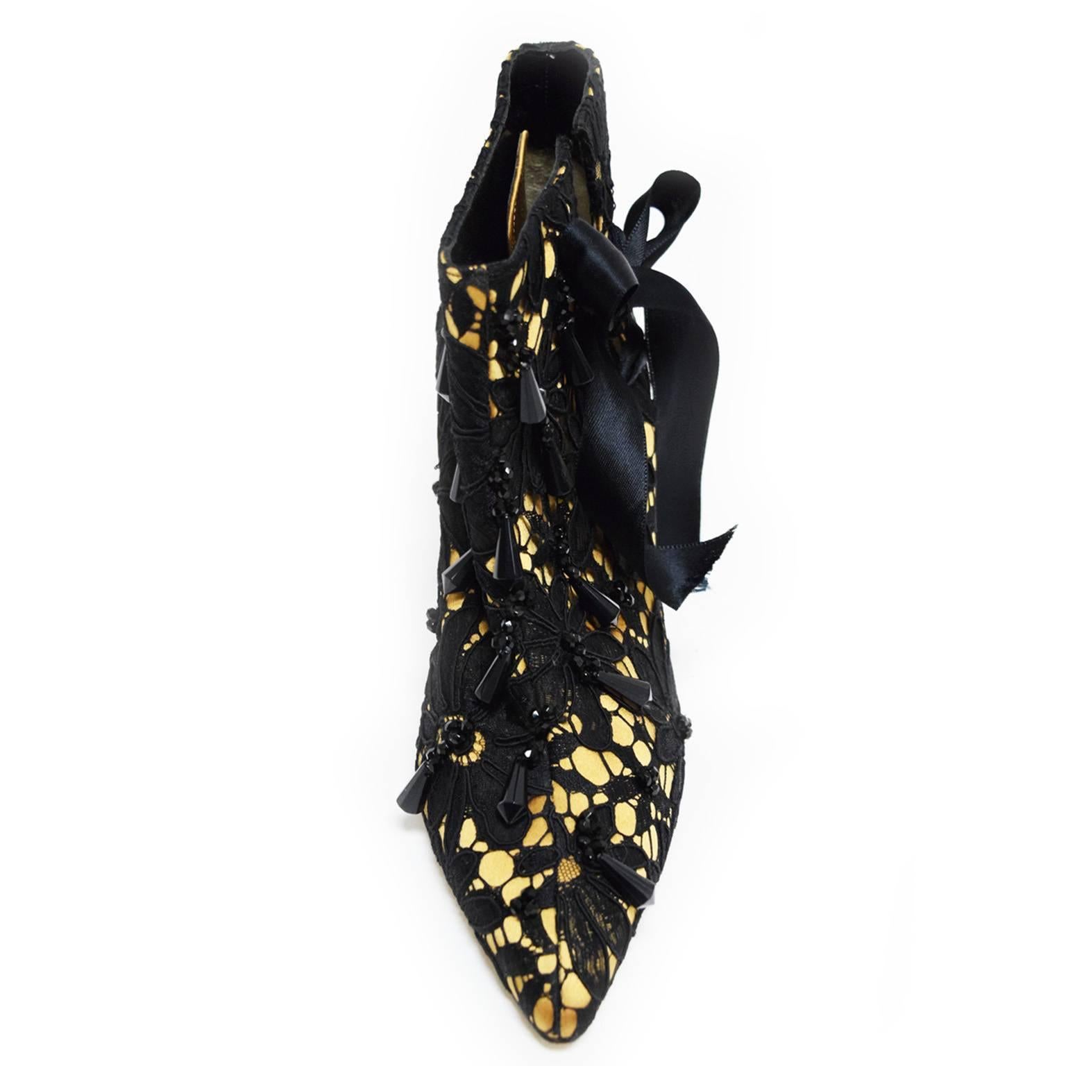 The Tucky shoe was featured in Blahnik by Boman book and are dated back to  1998. The Tucky is covered in black lace on top of a beige satin underlay. The heels lace up on the side with a satin ribbon creating a delicate look and complimenting the