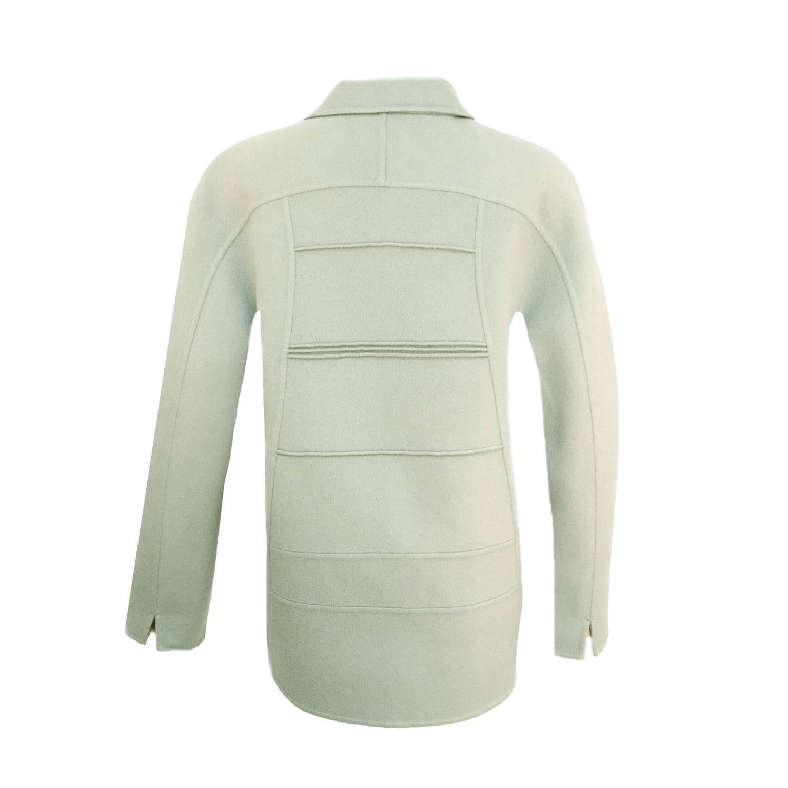 This Chado Ralph Rucci Jacket is single breasted and 100% Cashmere. Piping detailing to add a more structured look across the breastplate down to hipline. This jacket is long sleeved and has side pockets and ivory buttons for the perfect subtle