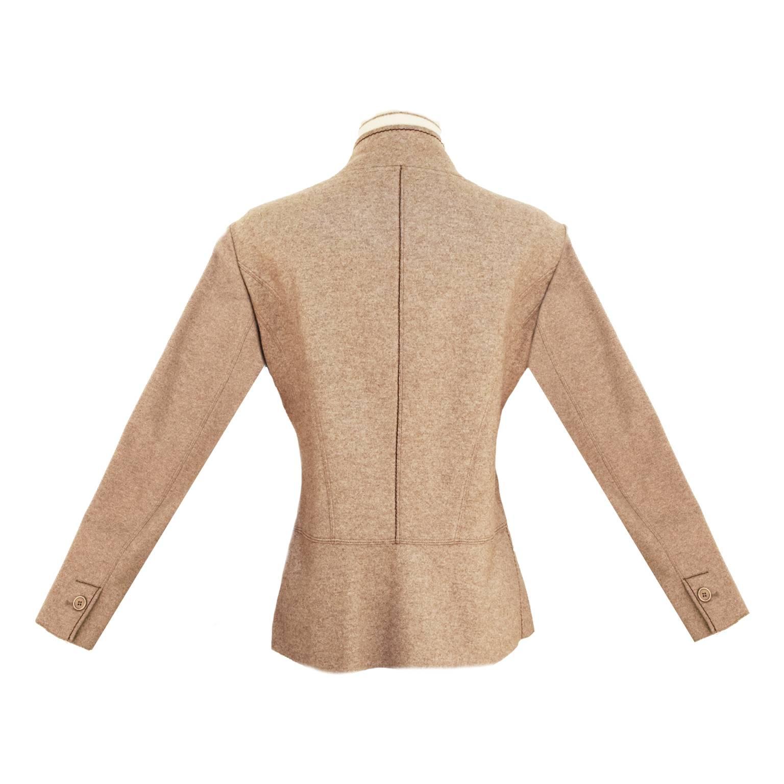 Beautiful, ultra soft brown cashmere and cream layered knit jacket by Brunello Cucinelli. The jacket is single breasted and features curved front piping detail at front, base and on back of sleeves. Princess lines through back. 3 button closure. 