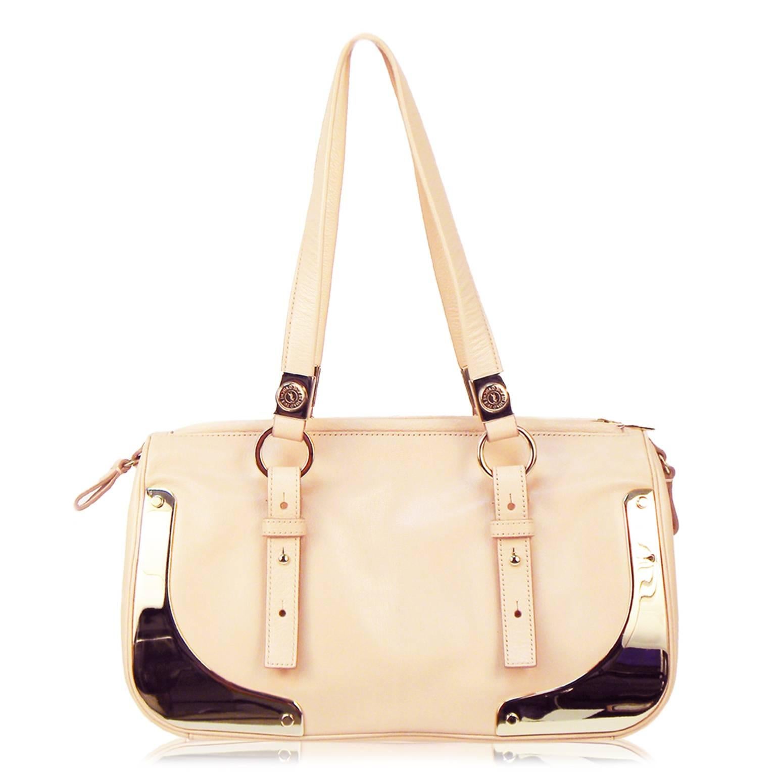 Pale pink Saint Laurent satchel bag with gold hardware and adjustable shoulder straps. Zipper Closure. 
