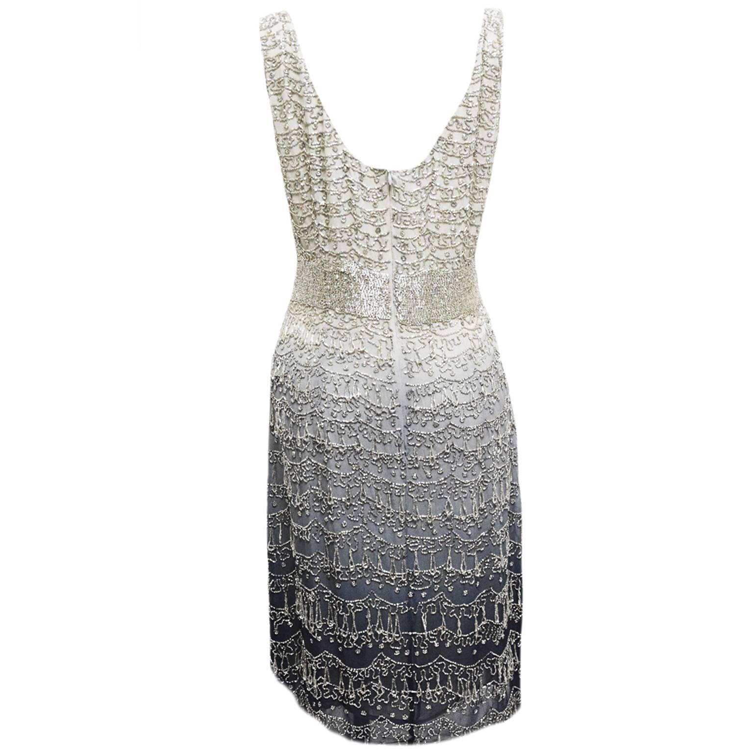 This exquisite Douglas Hannant Cocktail Dress is one of a kind. 100% ombre silk chiffon with hand sewn glass bead work for a fabulous intricate design pattern. Zipped Back. Glass bead drop bottom border. Above the knee.