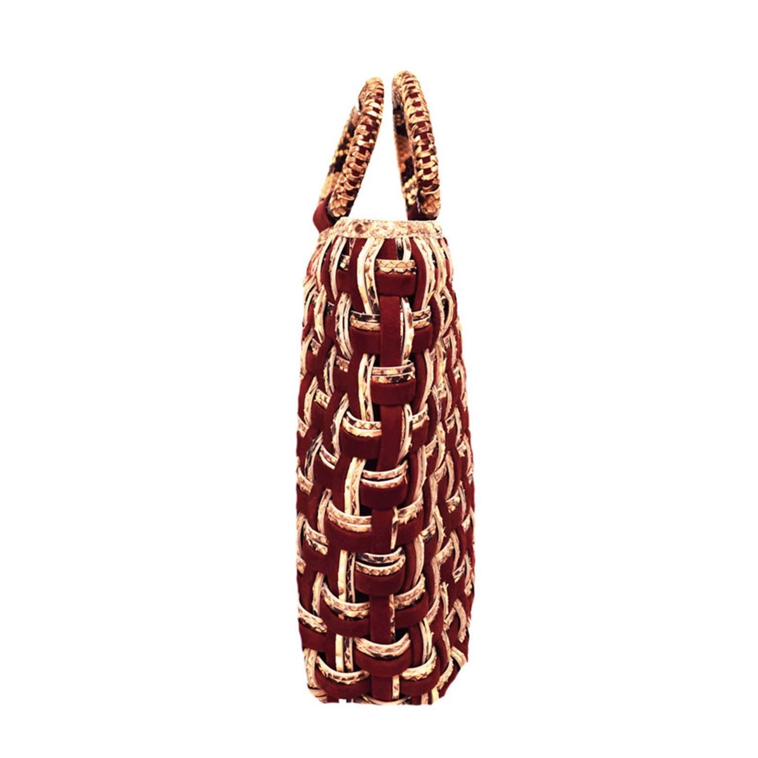 This Nancy Gonzalez woven handbag is one of a kind and hard to find. Made with Merlot suede and neutral colored snakeskin leather weaving a beautiful contrast. 3 inch strap drop. Fabric inside.