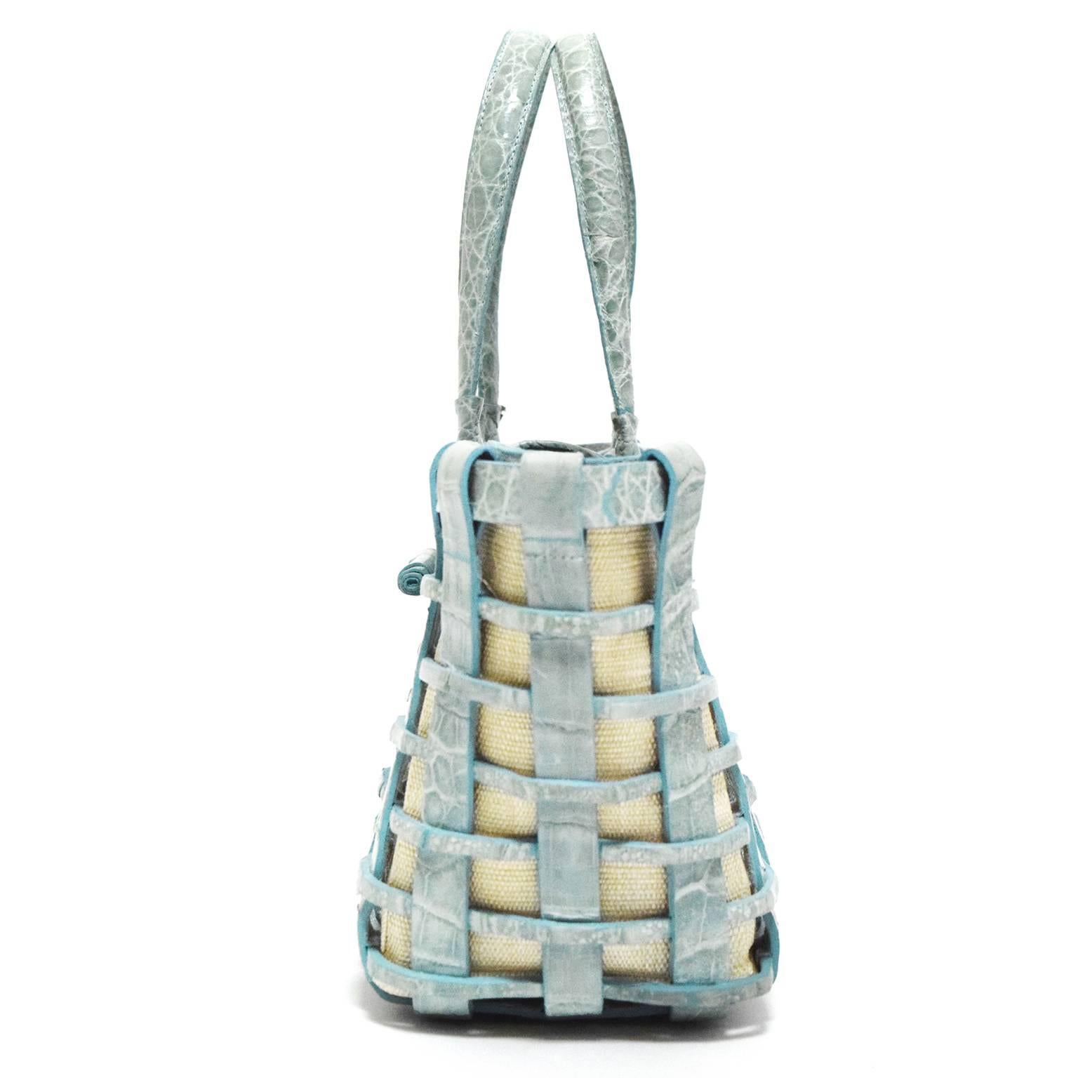 This Nancy Gonzalez Mini Tote is made from croc leather and is woven into a beautiful structured tote. Lined with beige canvas for a subtle contrast with the seafoam coloration. Looped Closure, and inside suede.  Strap drop 7.5 inches.