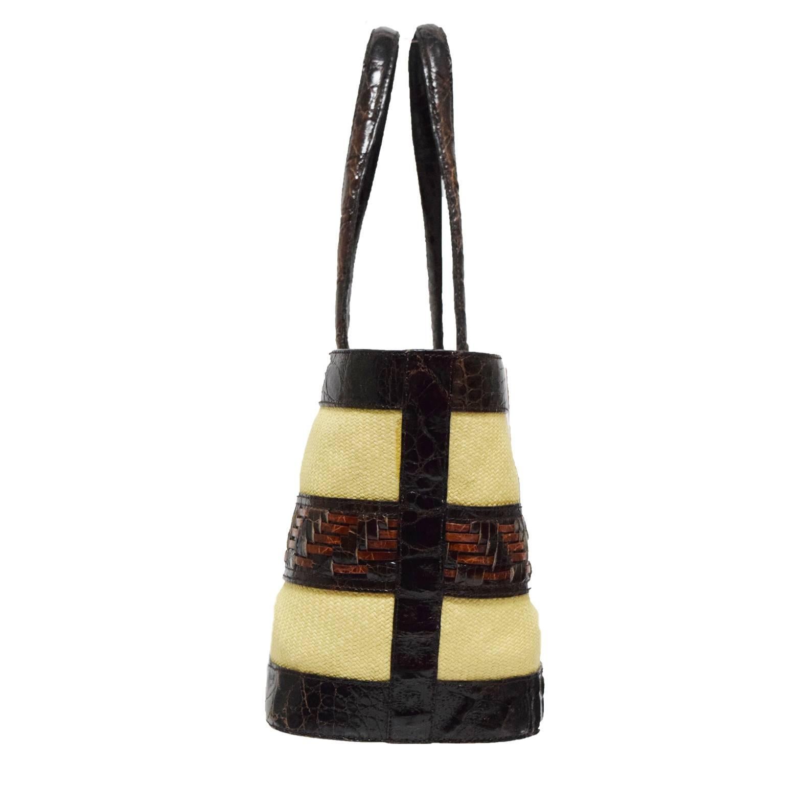 This Nancy Gonzalez Croc Tote is made from real dyed Crocodile, natural straw in chocolate brown and beige and are basket weaved to create this structured tote. Strap Drop 12 inches. 