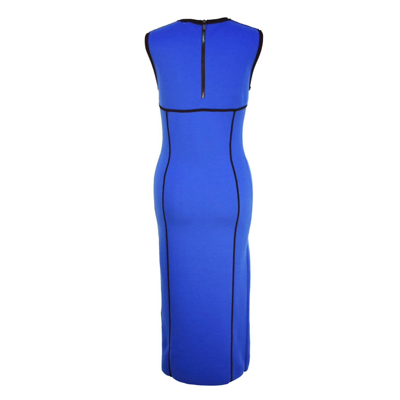 This sleek and sexy Michael Kors Body Con Midi Dress hits right at under the knee, and is made of wool, nylon, and elastic knit for comfort. Comes in a royal blue and has black contrasting lining for a sophisticated look. 