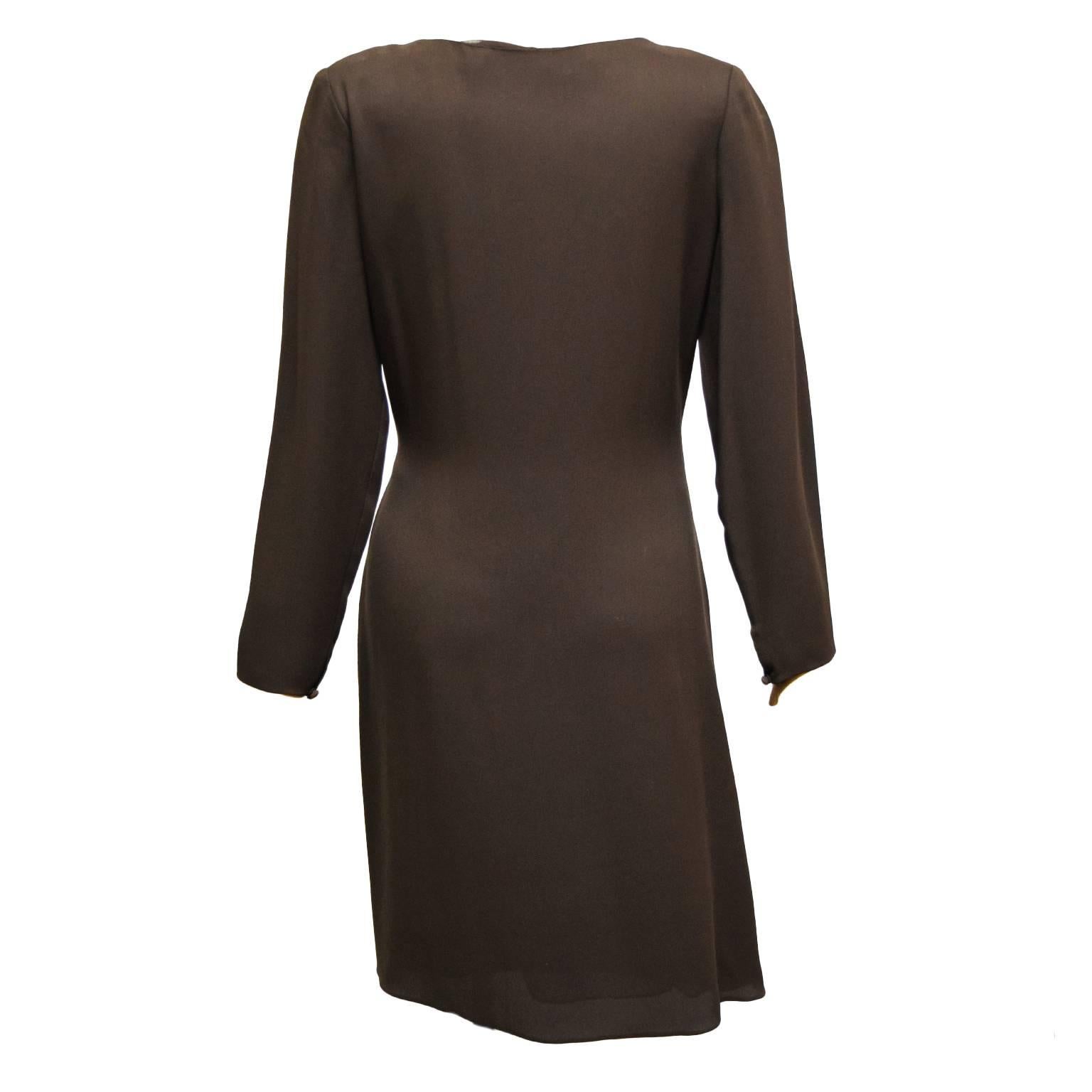 This beautiful Carolina Herrera dress is made of a  rich deep brown and is gathered at the waist to create a slimming illusion. The bodice is sheer silk crepe and has intricate iridescent sequins and glass beading detail.