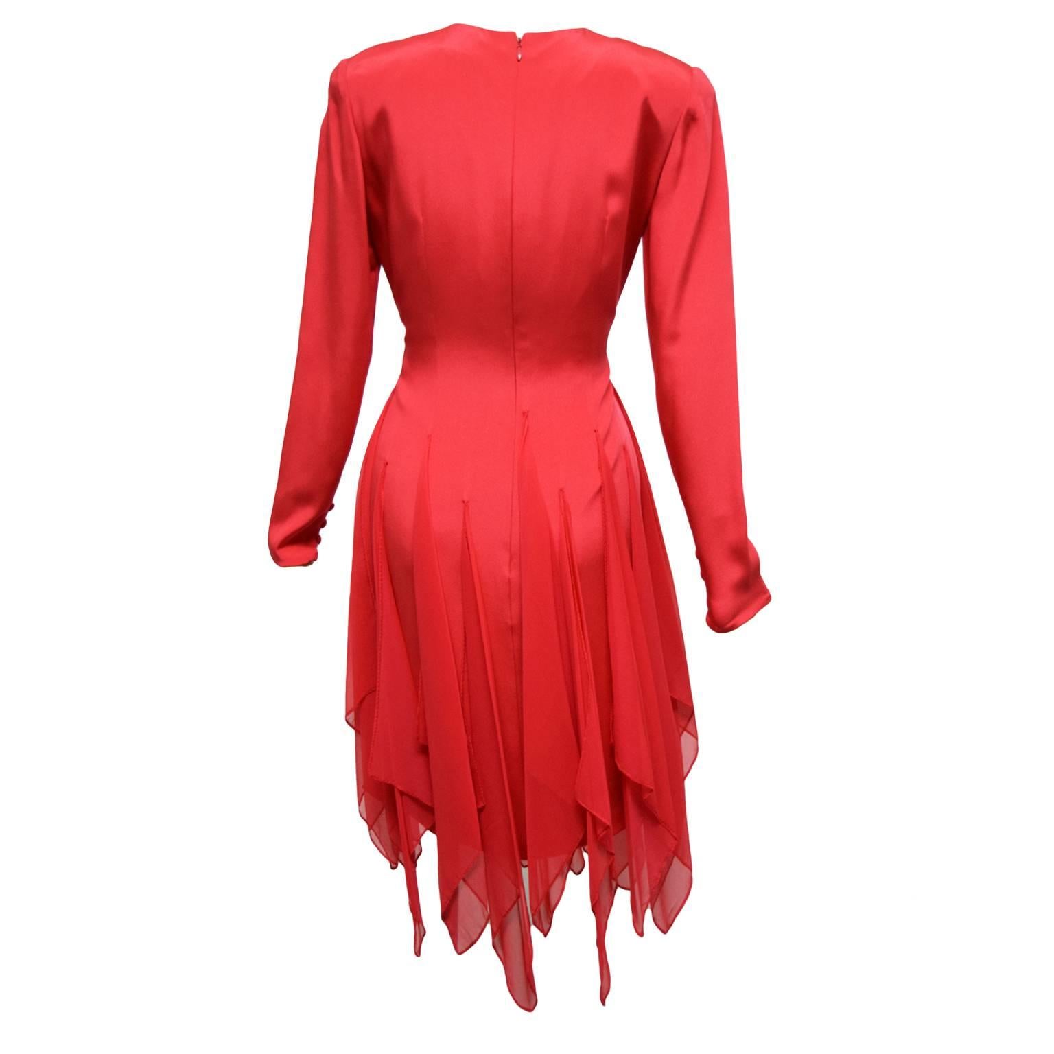 This beautiful one of a kind dress designed by Bill Bass is made of 100% silk and is fully lined. It is long sleeved and has slightly lifted removable shoulder pads for contrast. The skirting part of the dress is a type of handkerchief design and