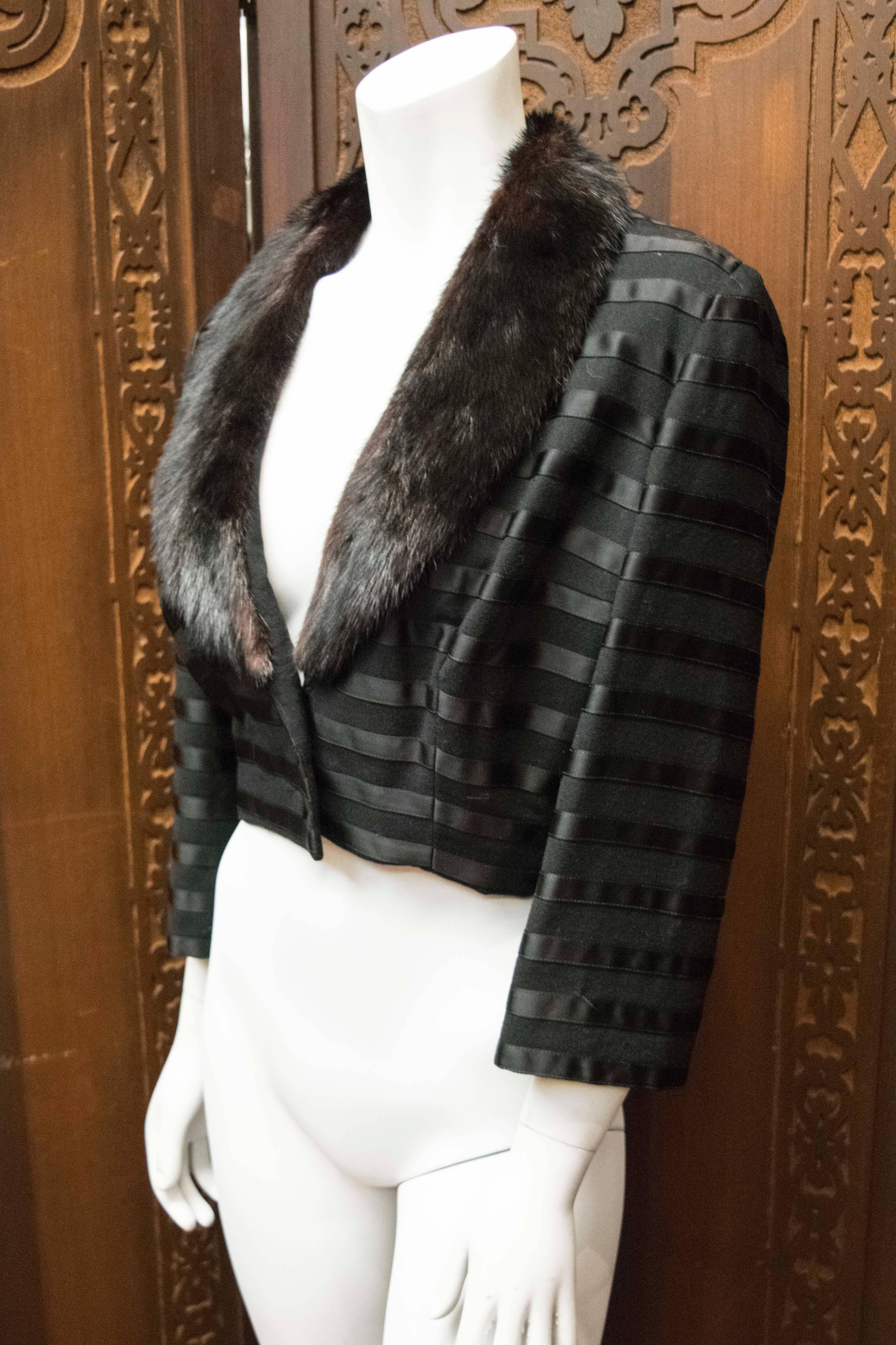 Black Bolero Jacket w/ Mink Collar

Stunning bolero jacket with silk satin stripe details and fabulous Ranch Mink shawl collar. 

B 40 
L 19