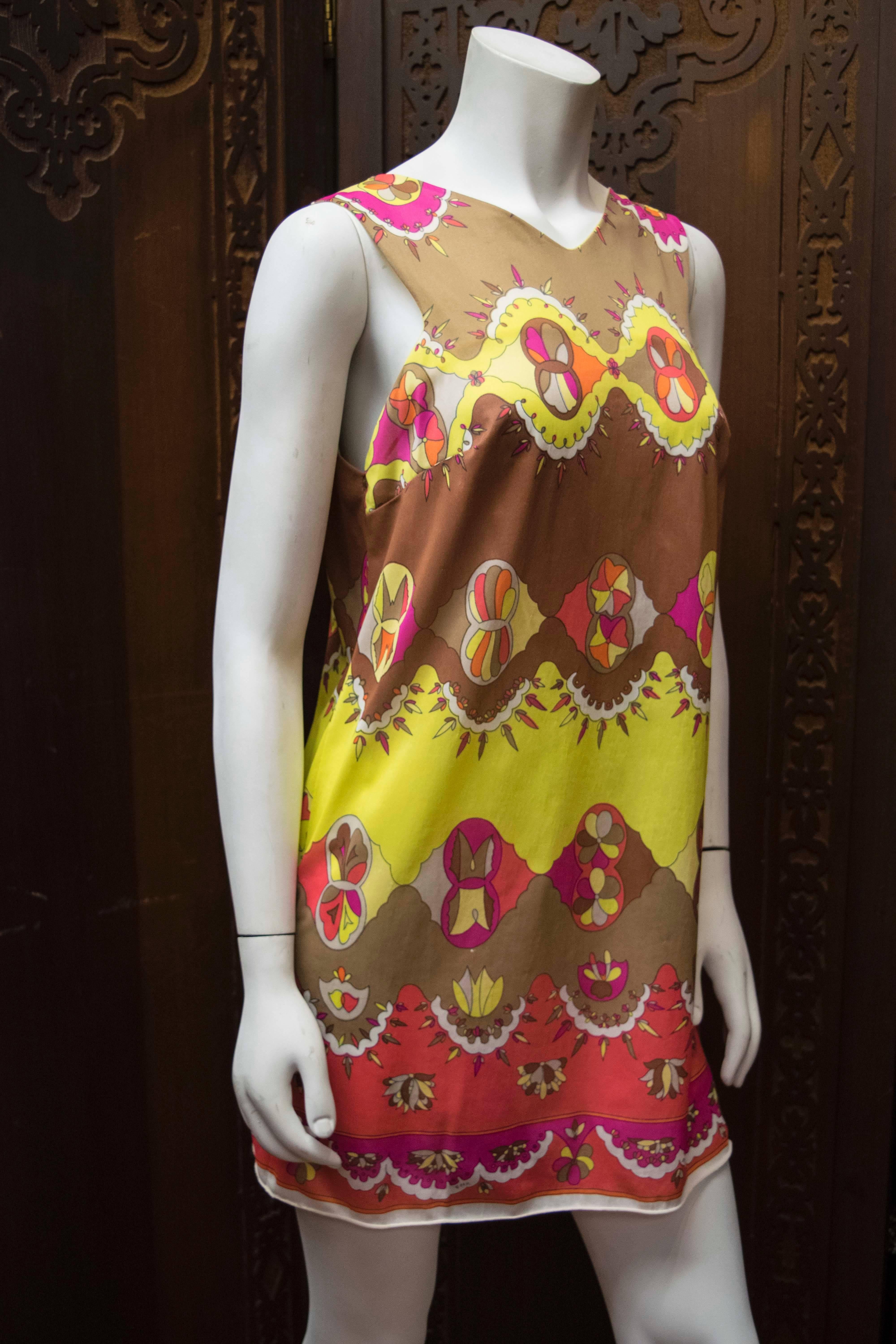 Emillio Pucci Slip Dress
Fabulous 1960s Pucci mini dress for Formfit Rogers. Trademark kaleidoscopic print.   

36 to 38 inch bust
N/A waist (since this dress has a shift/straight-waist silhouette)
39 inch hip
31 inch length

Note that this dress