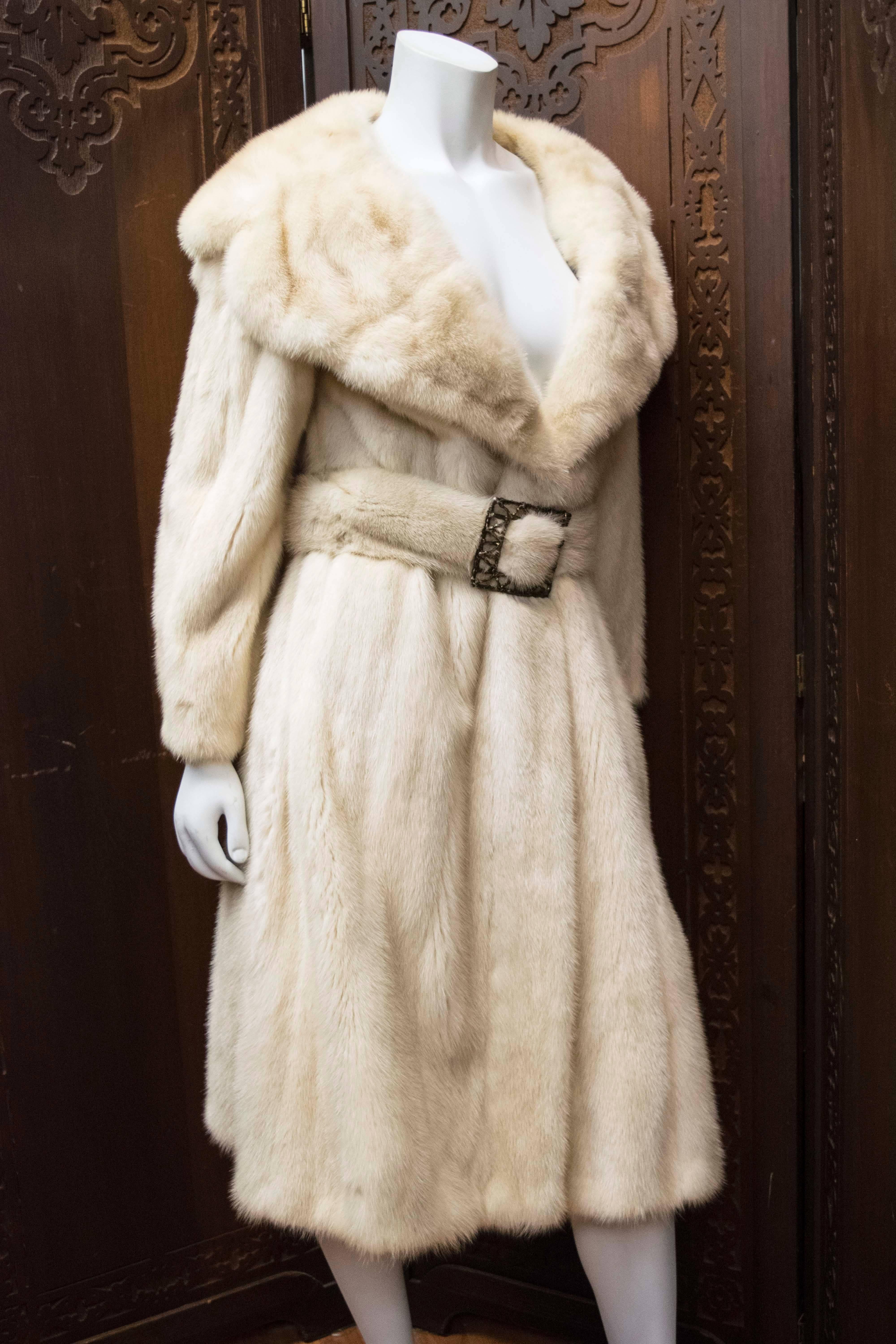 Ivory Mink Fur Coat

Beautiful long mink fur coat with original mink belt with rhinestone detailing. The perfect piece for any lover of fur. 

B 36
W 36
H 40
L 48