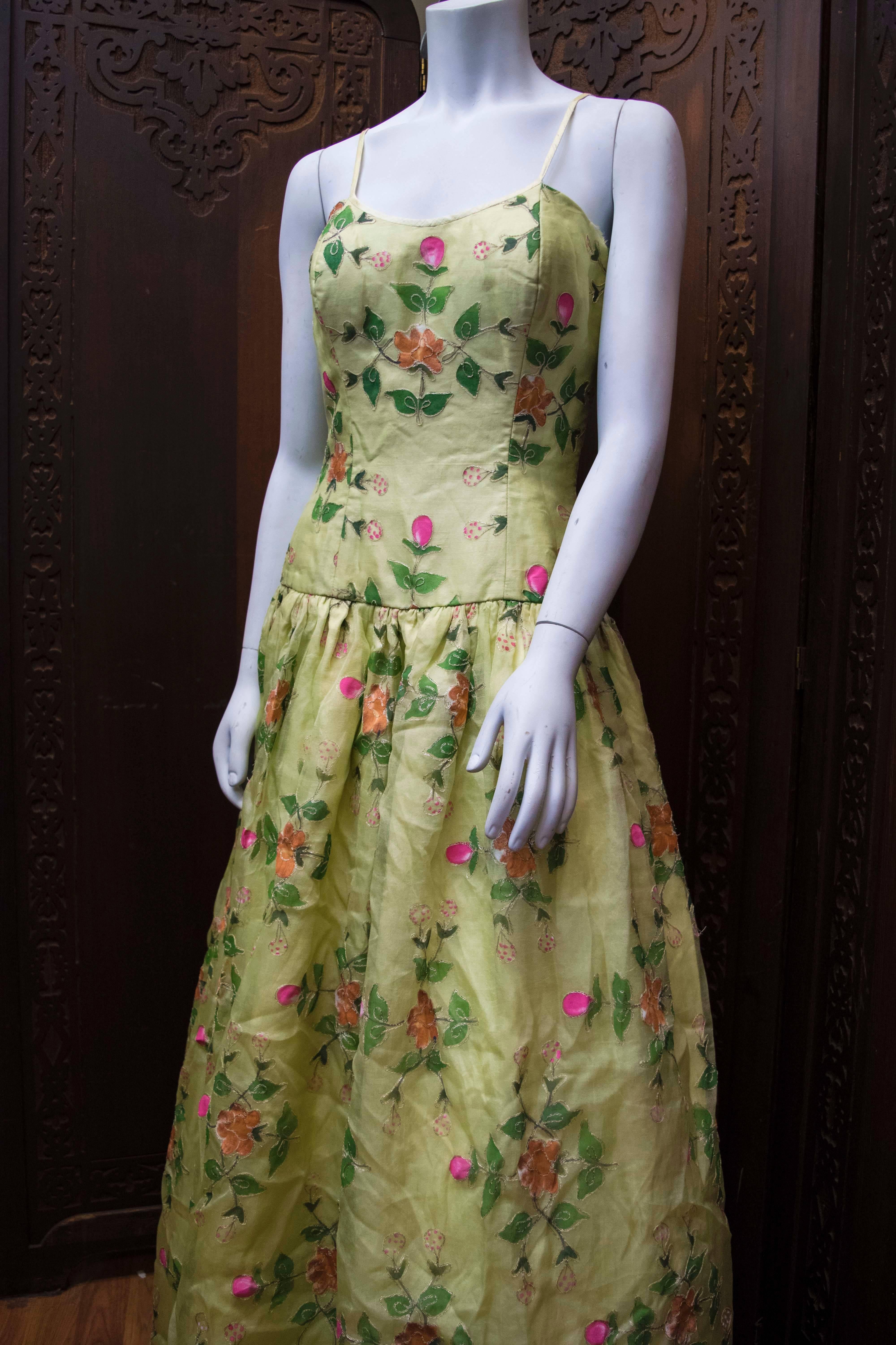 1960s Max Nugus Couture Light Green Hand Painted Gown 

This vintage haute-couture gown is in great condition. Perfectly working back-zipper. This is an amazing gown that is extremely flattering on with its romantic floral detailing, and boned