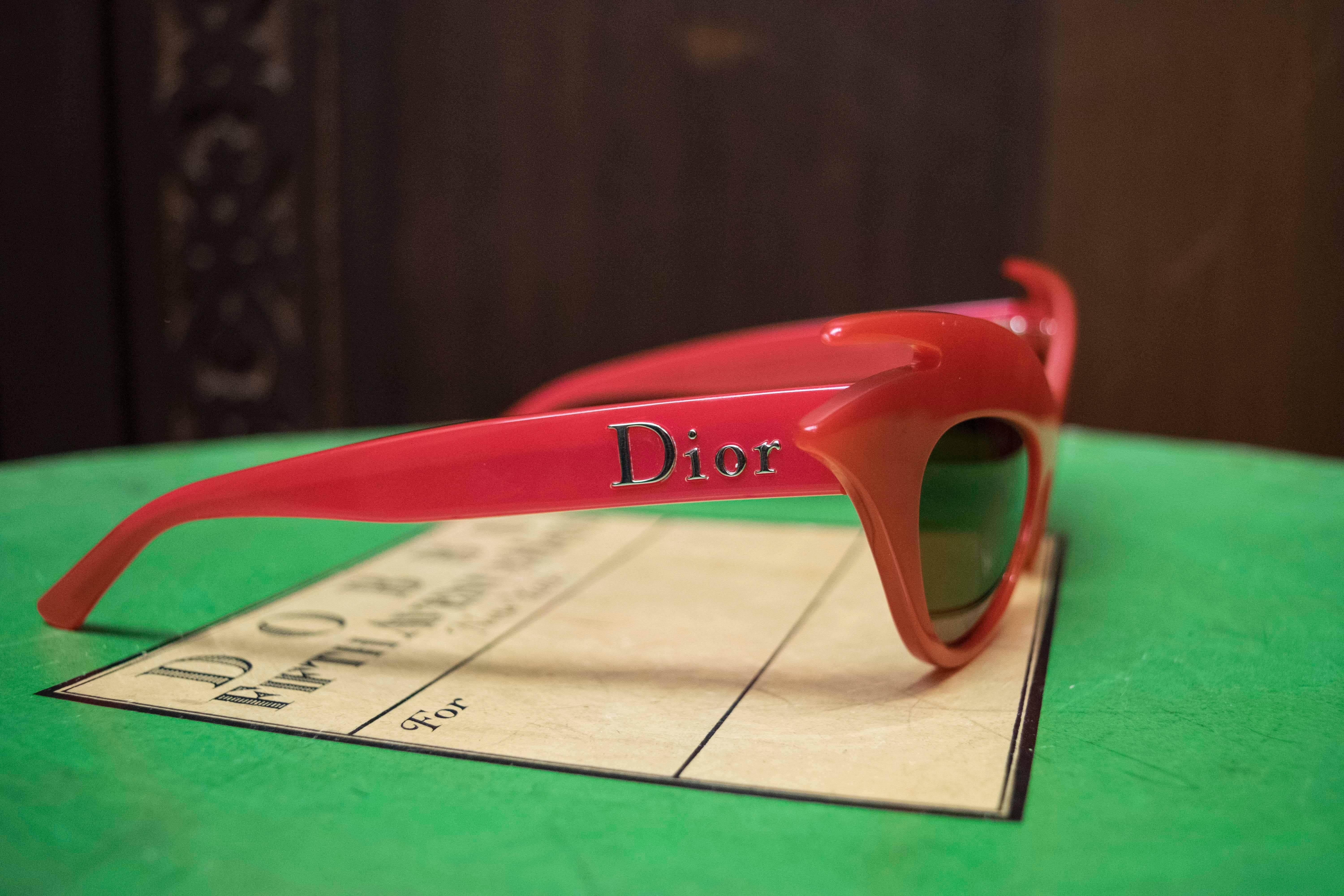 Miss Dior Cherie limited edition sunglasses in raspberry red. Commissioned by Sofia Coppola for the Miss Dior Cherie commercial, they are number 466 out of 1000. 

Measurements:
Lens Width: 2 1/2