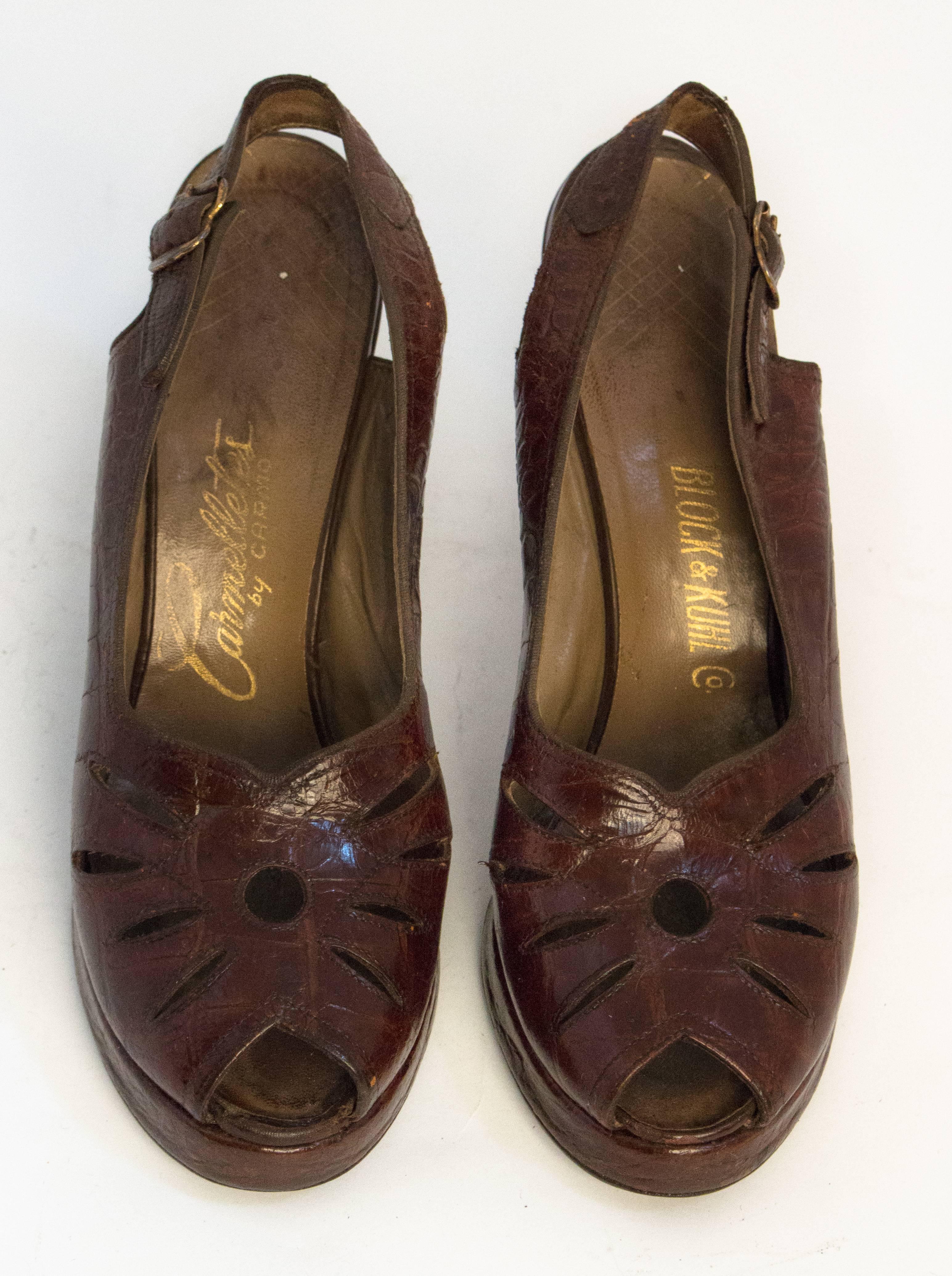 40s peep toe platforms. Cutouts on toe tops. Leather soles. 

Measurements
Insole: 9 1/2