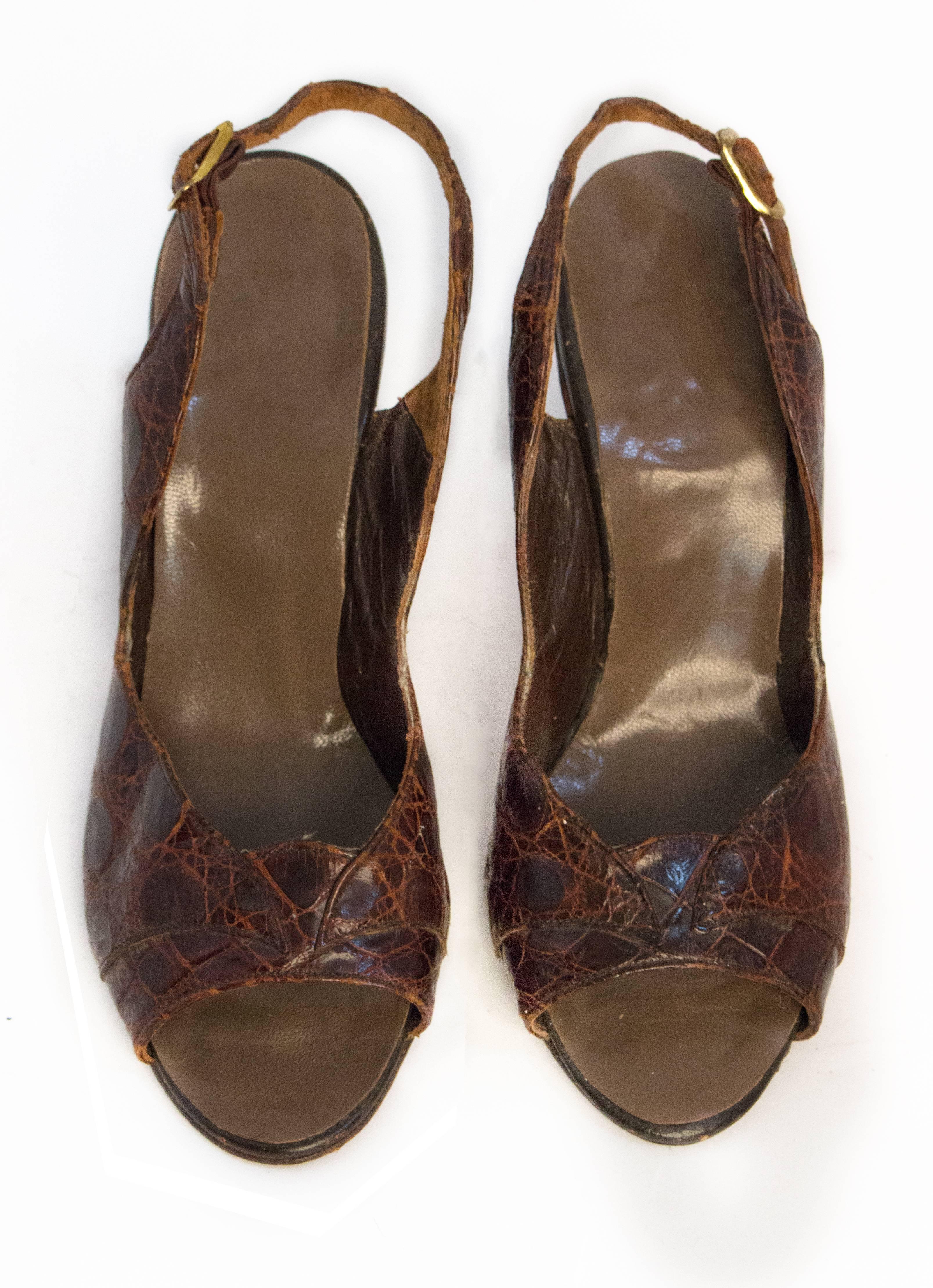 50s Brown Alligator Peptone Slingback Heels. Gold tone buckle. Leather sole. 

Measurements:
Insole: 8.5 inches 
Palm: 2.75 inches
Heel Height: 3.25 inches 