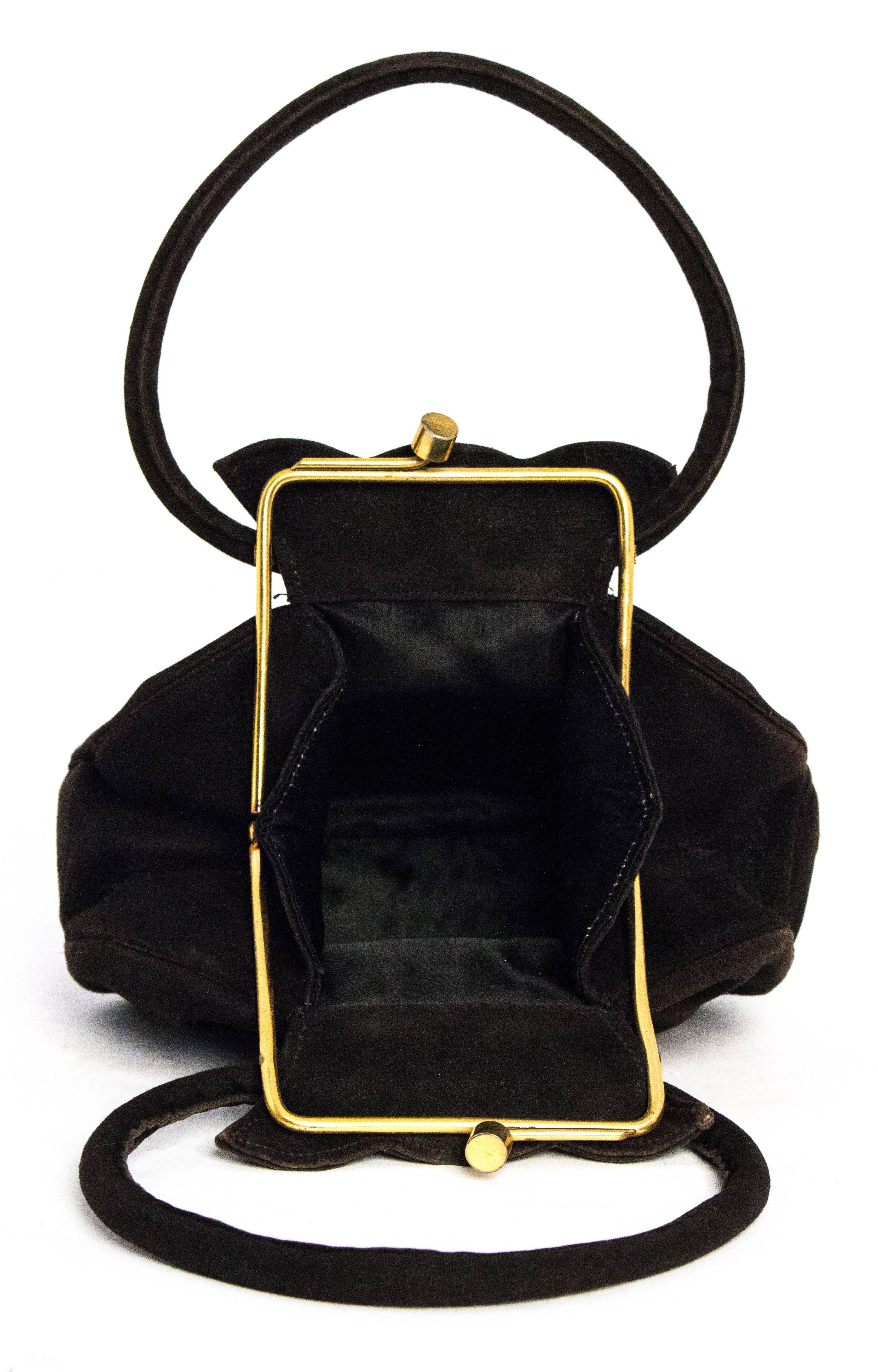 40s Black Suede Petite Handbag. Gold tone hardware. Satin lining with two small compartments. 