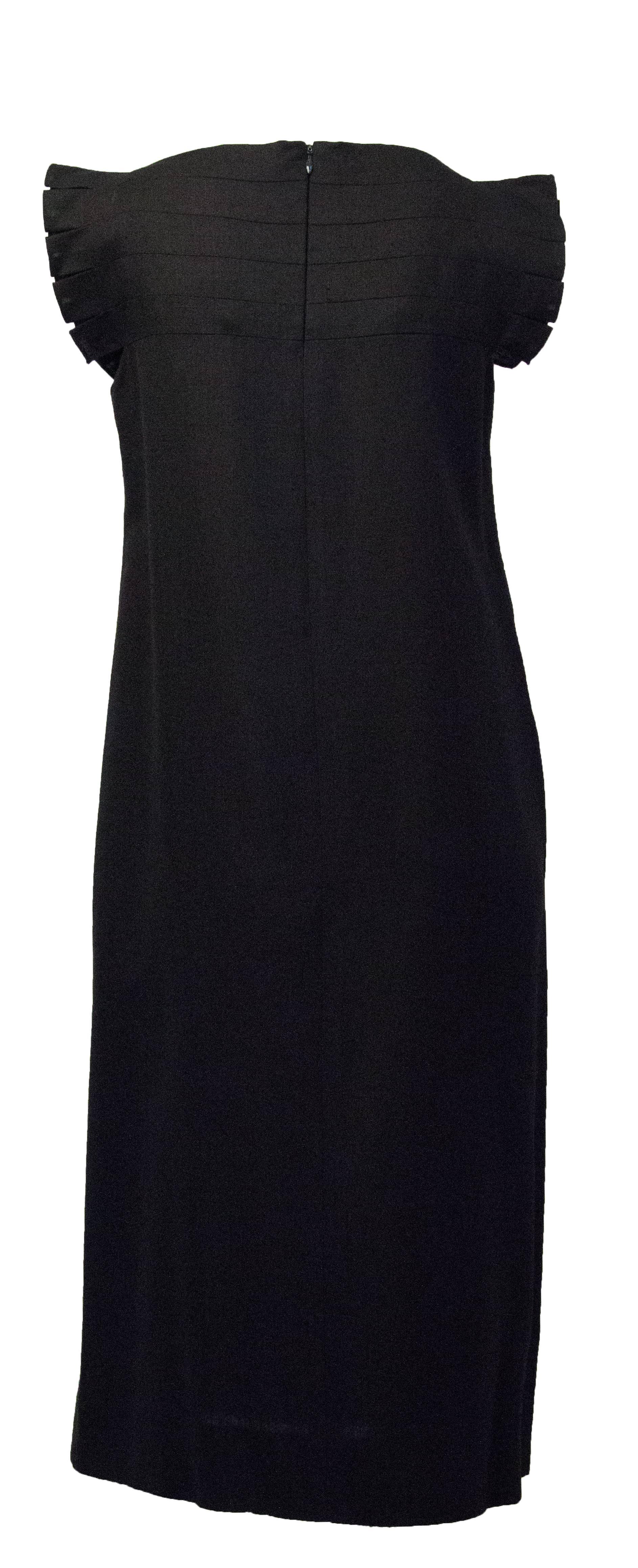 80s black shift dress with notched shoulder detail. Nylon zipper up the back.

