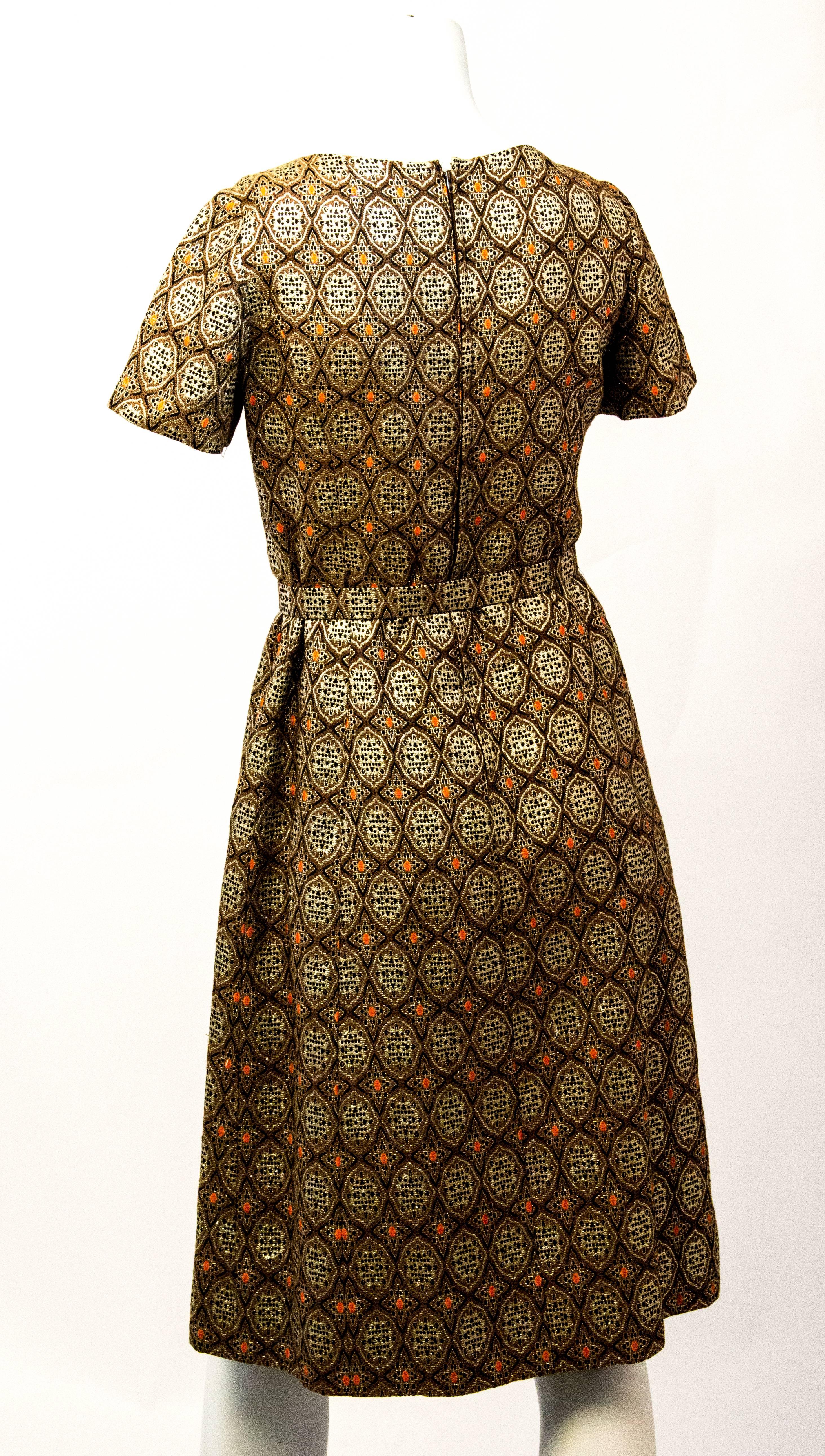 60s gold metallic brocade dress with original matching belt. Fully lined. Zips up the back. 
