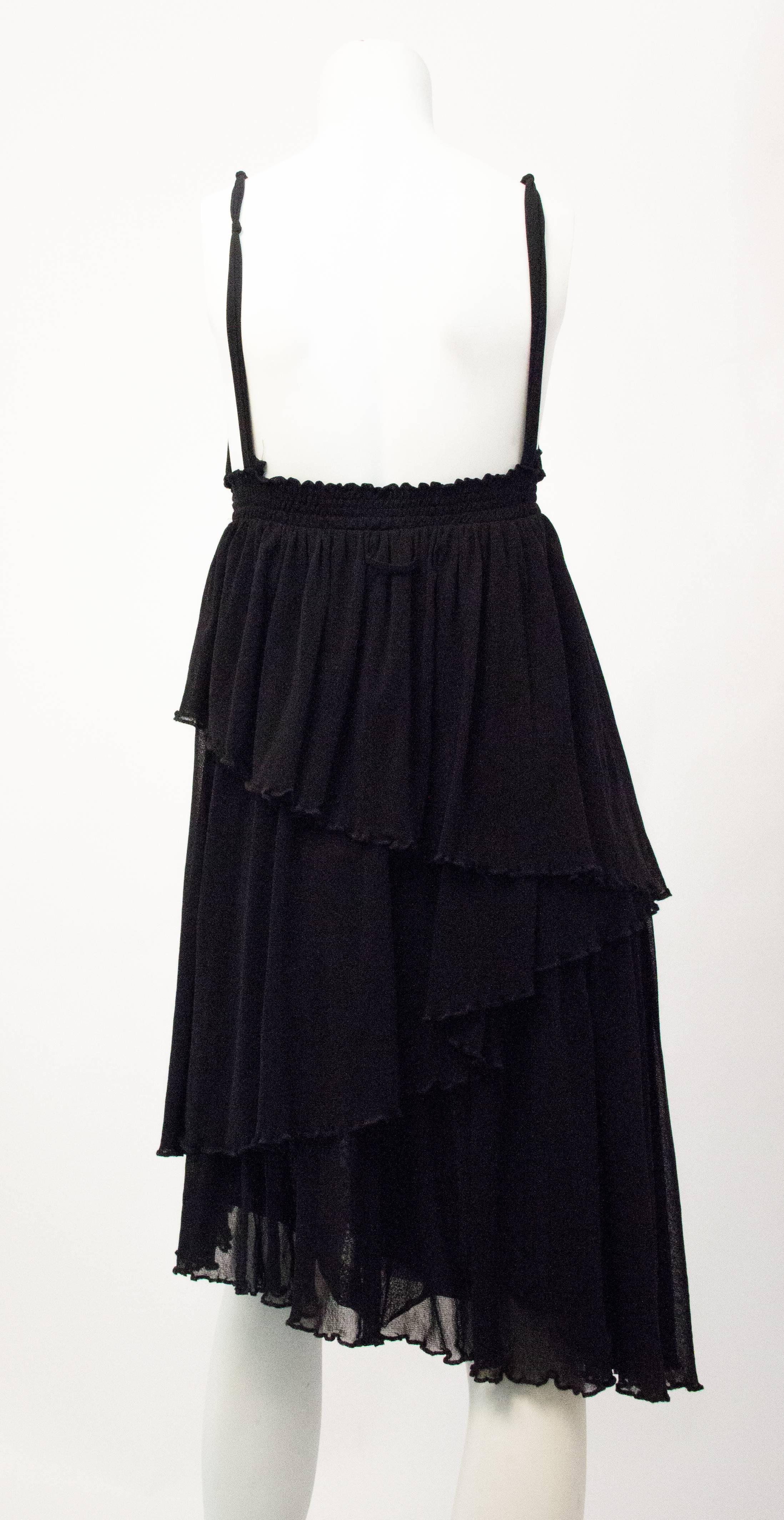 90s Jean Paul Gaultier black mesh tiered dress. Thin elastic band under bust. Fabric is stretchy. Original paper tags included. 