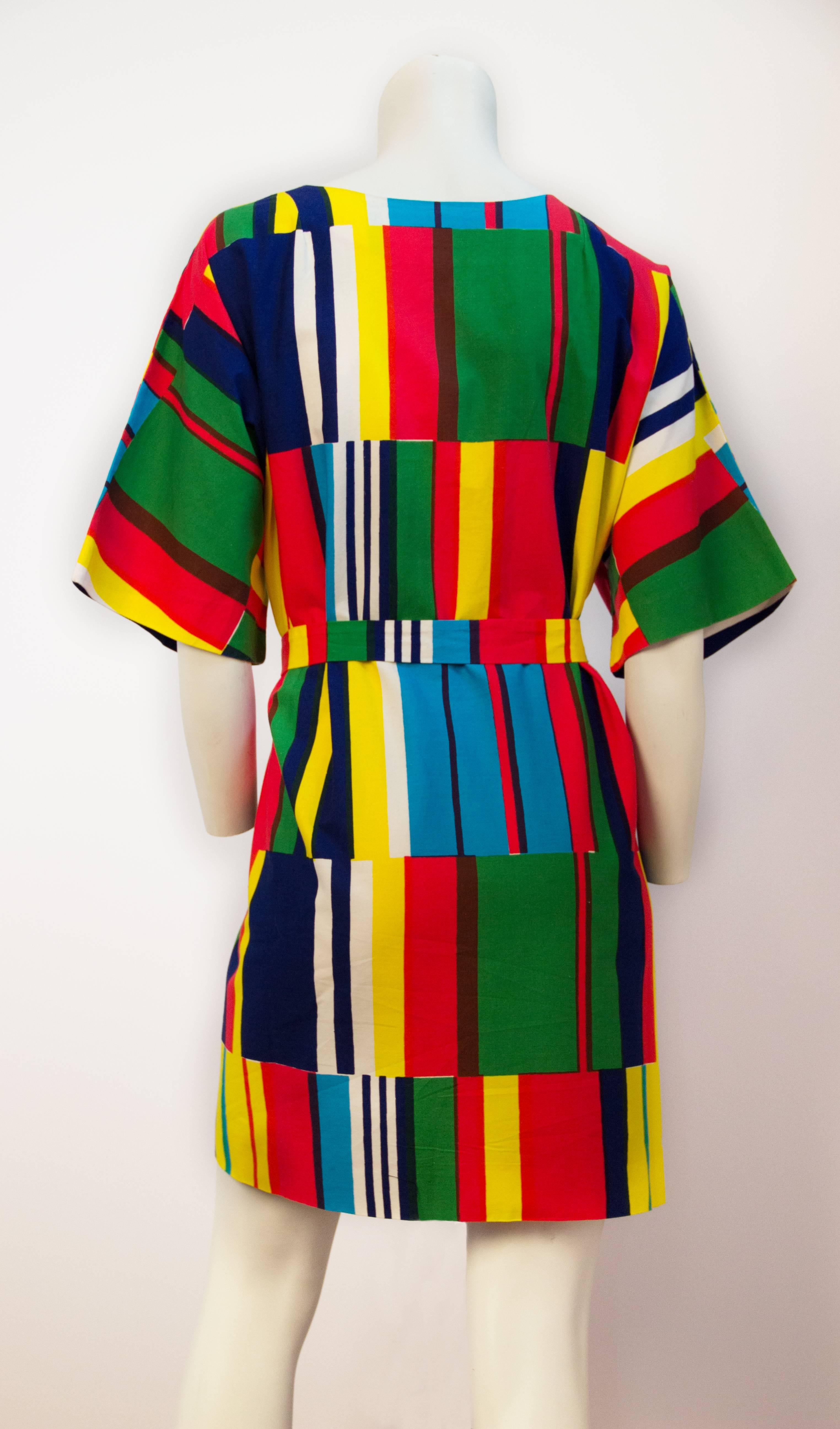 70s Marimekko printed dress. Inset side pockets. Zips up the front. Original sash.