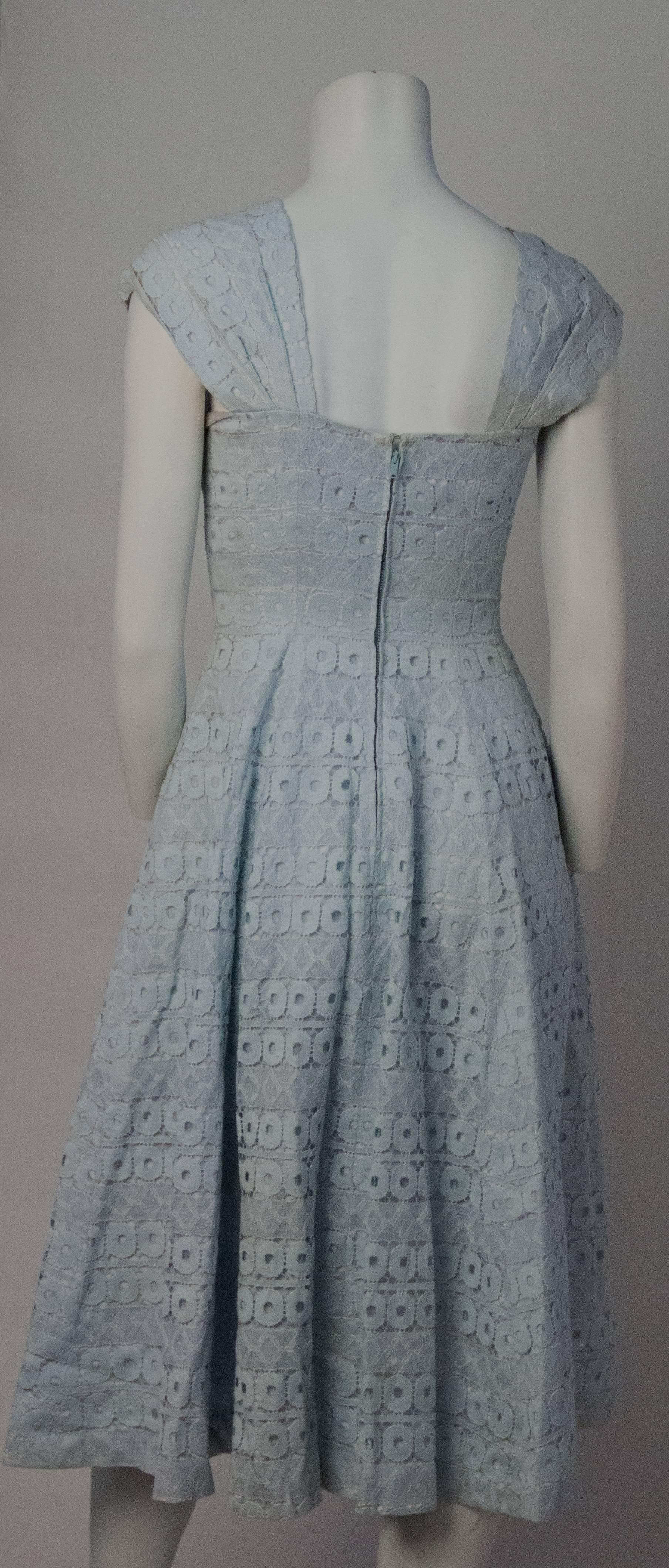 50s Suzy Perret baby blue lace dress. Satin bow detail along front. Metal zipper up the back. Fully lined.  