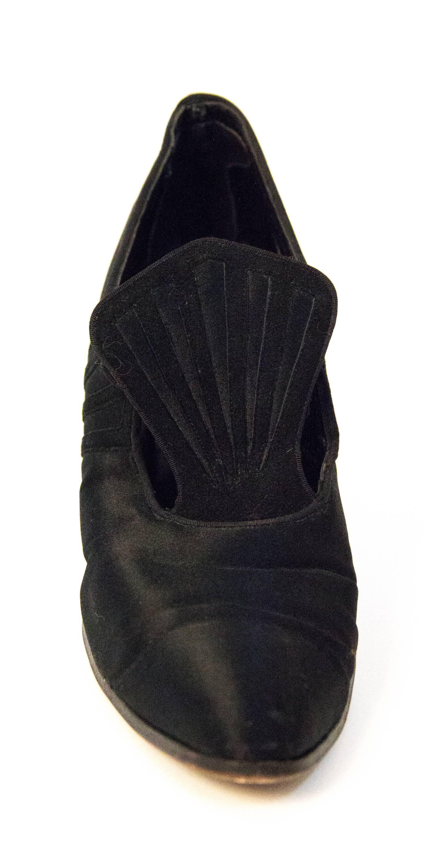 Edwardian black silk heels with suede cutout details. Button closure. Lined in thin leather. Leather soles. 

Measurements:
Insole: 10 inches 
Palm of the Foot : 2 3/4 inches
Heel: 2 7/8 inches 

