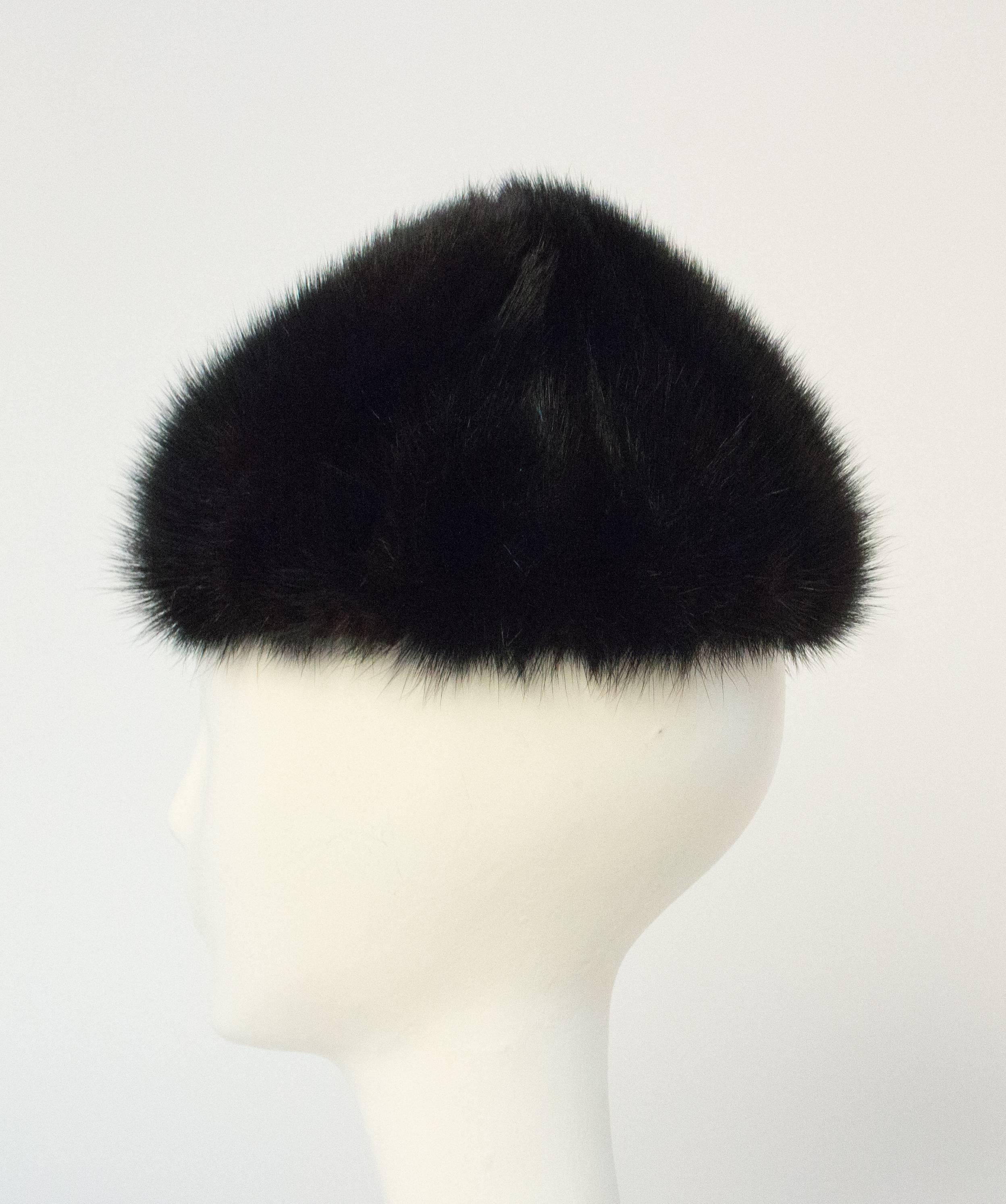 60s Black Mink Hat. Lined in grosgrain. Grosgrain interior hat band. Original combs. Ment to be worn on the back of the head. 