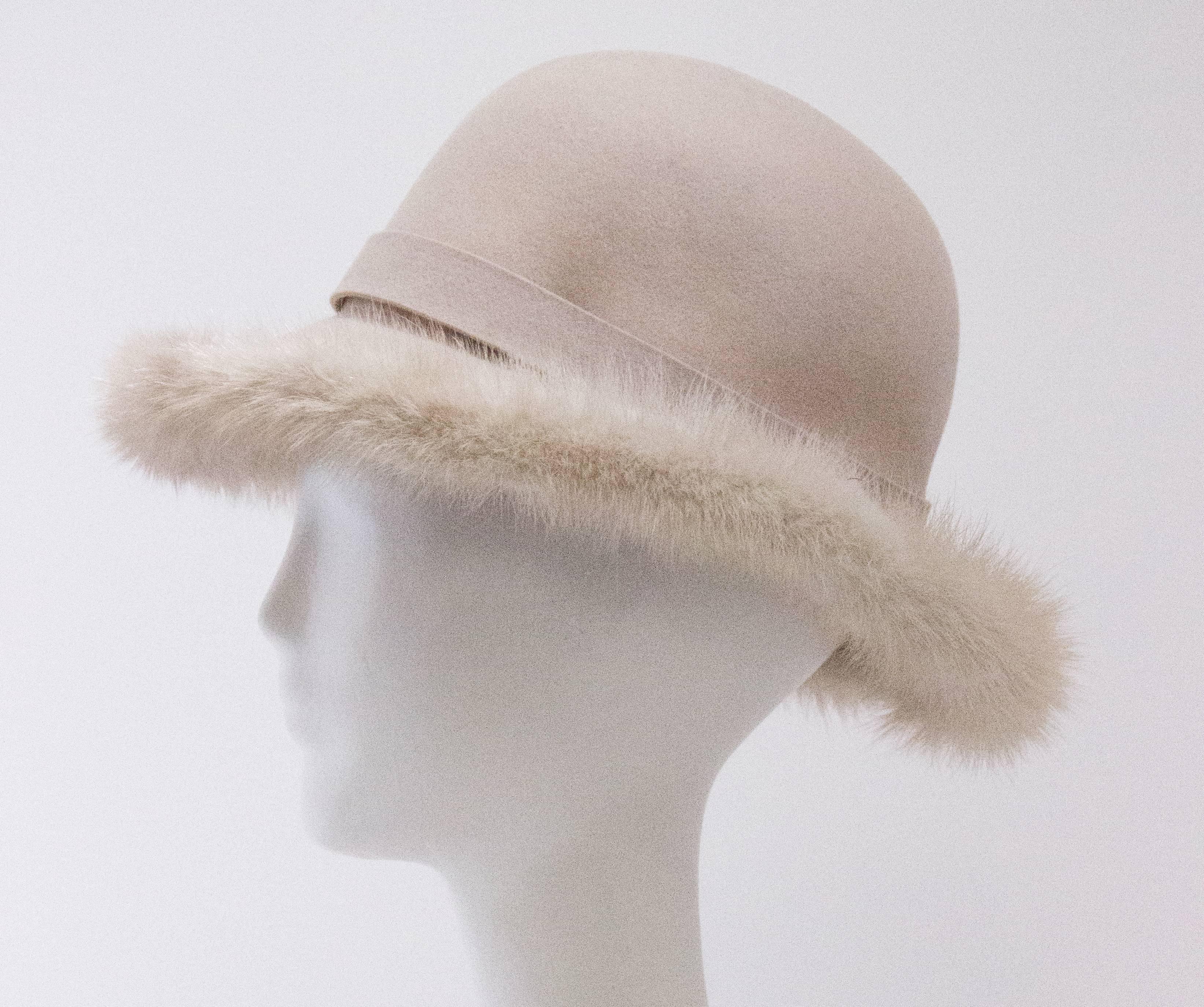 60s Mr. John Cream Felt Hat with Mink Trim. Interior grosgrain hat band. 

Measurements:
21 1/2 inch interior hat band 

