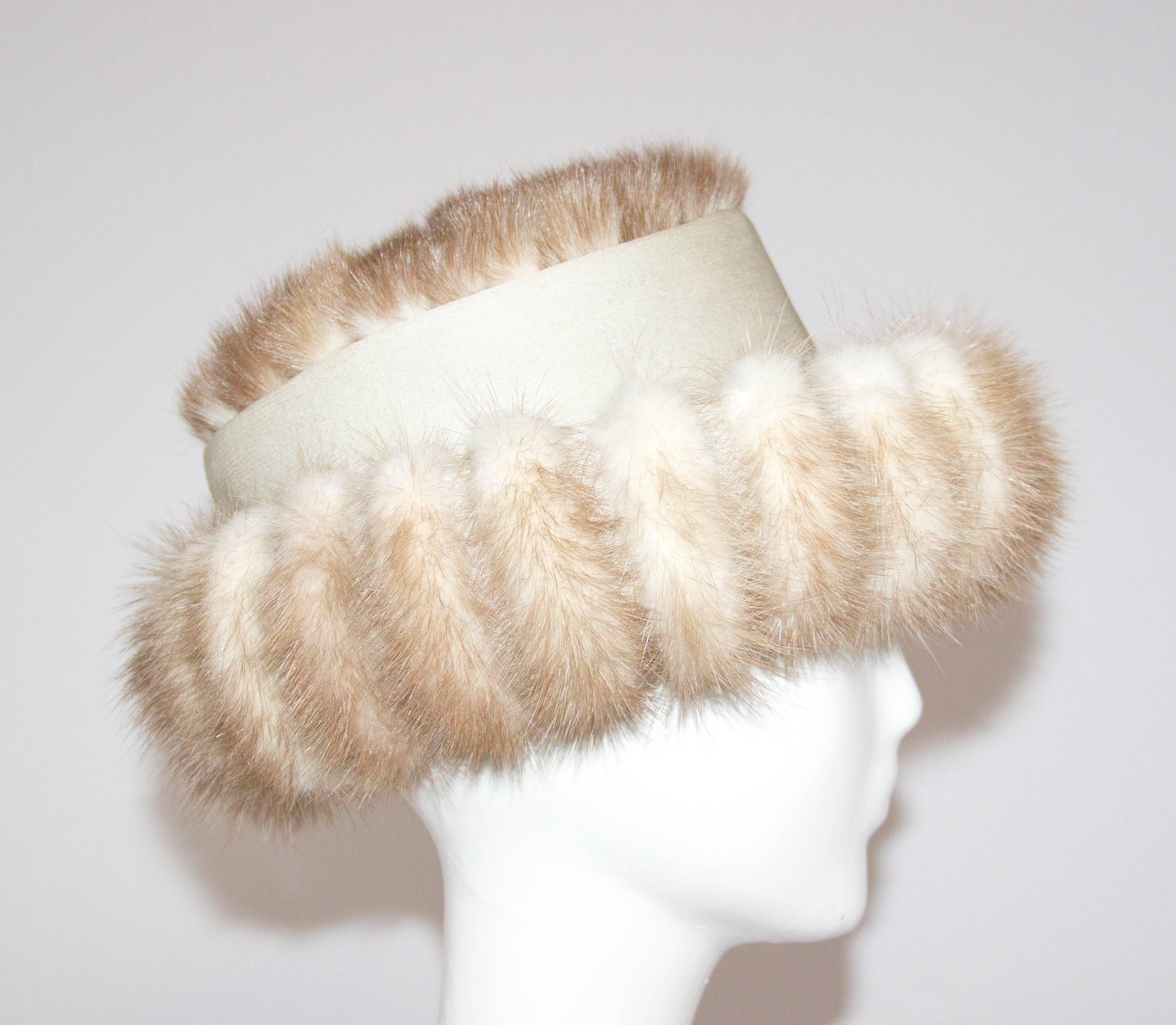 60s Blonde Coffee Mink Hat. Wire frame along brim for shaping. 

21 1/2 circumference 