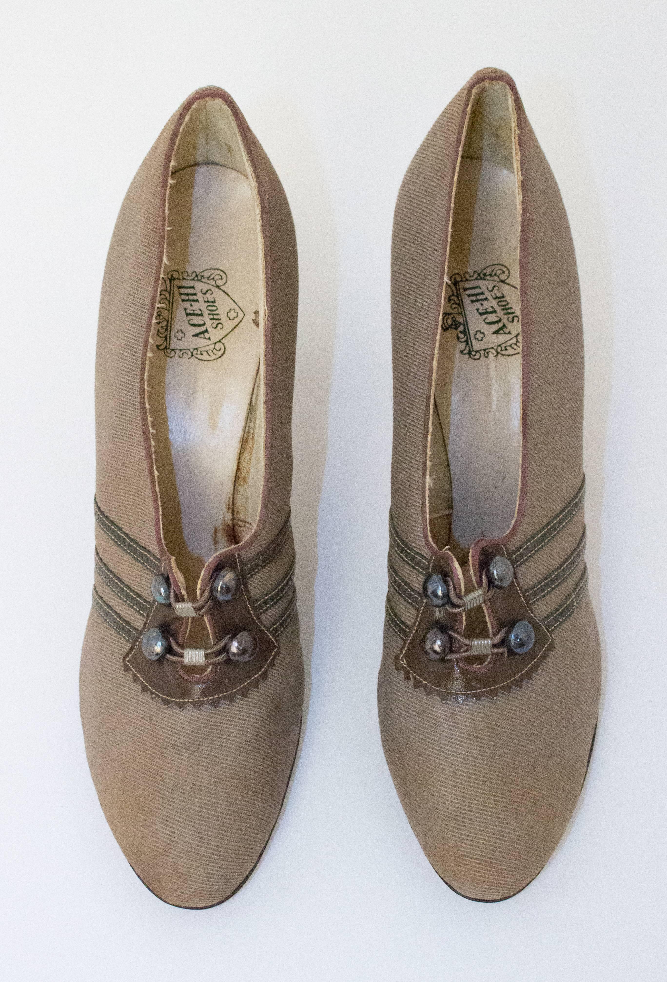 20s Tan Fabric Heels with Grey Leather Detailing. Headstock, never been worn. 

Measurements:
Insole: 9 1/2