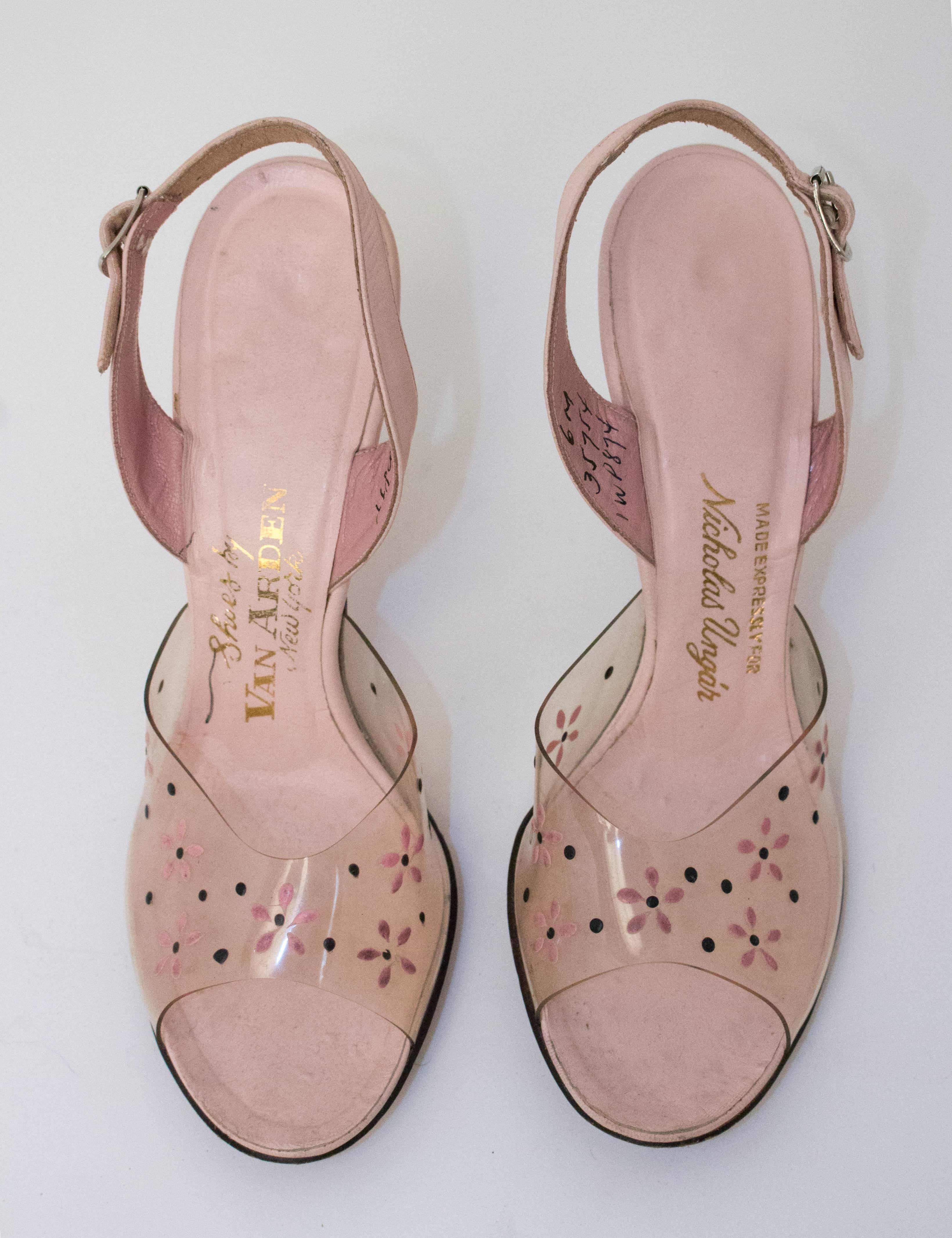 50s Pink Lucite Heels with Floral Painted Embellishment. Leather soles. 

Measurements:
Insole: 9 1/2"
Width: 2 3/4"
Heel: 3 1/2" 