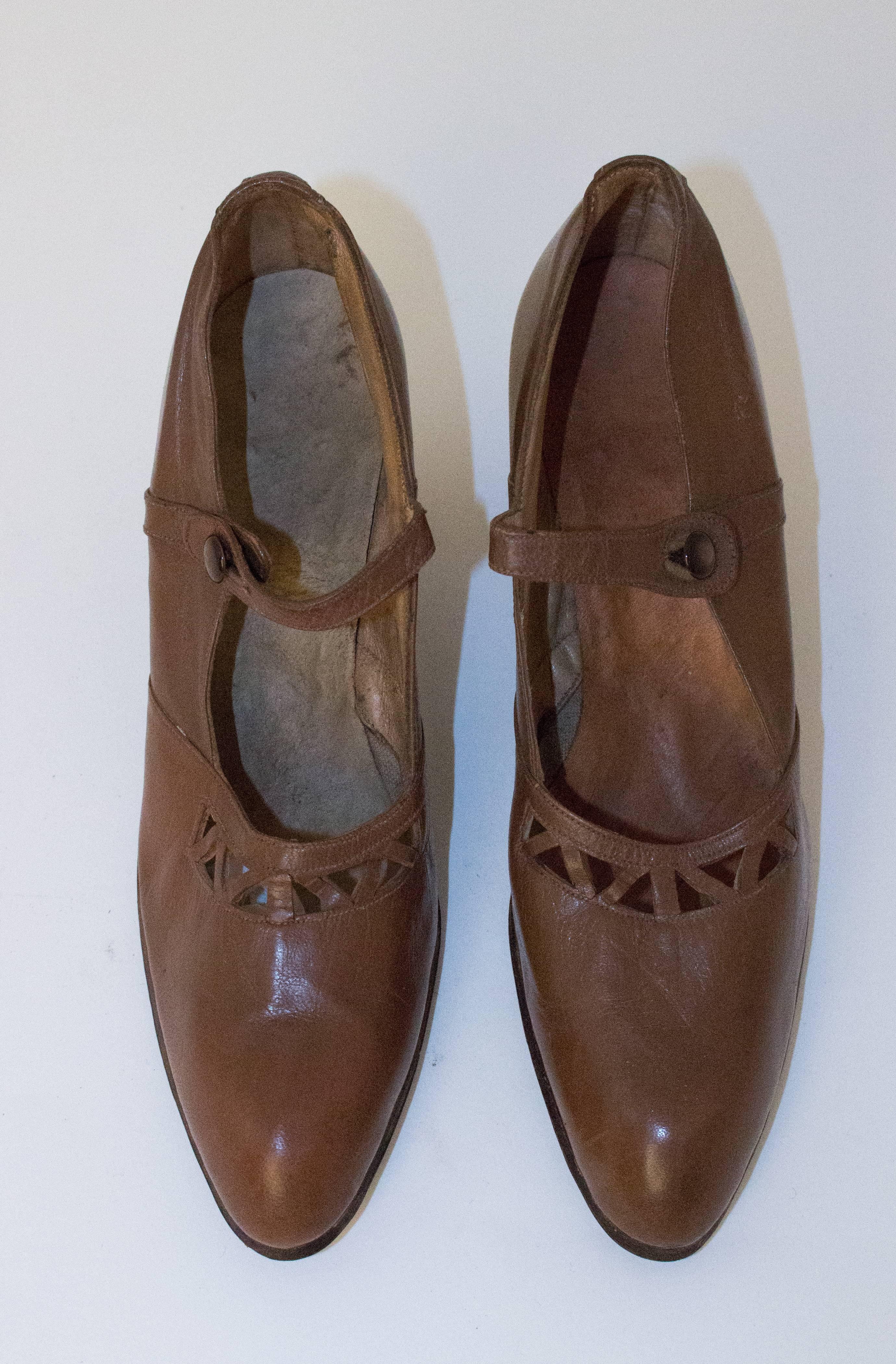 20s chocolate brown cutout heels. Measures 9 1/2 inches from toe to heel.