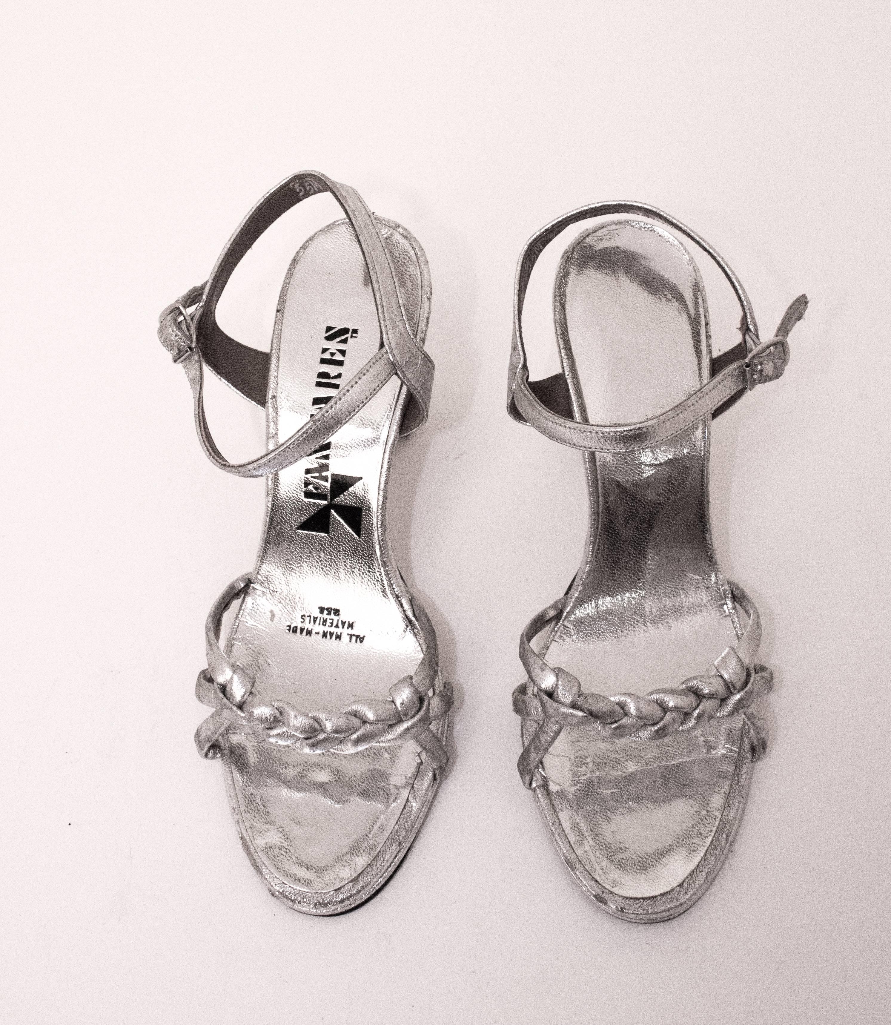 70s Silver Metallic Sandal Heels. Man made soles. Braided toe top detail. Featured in 