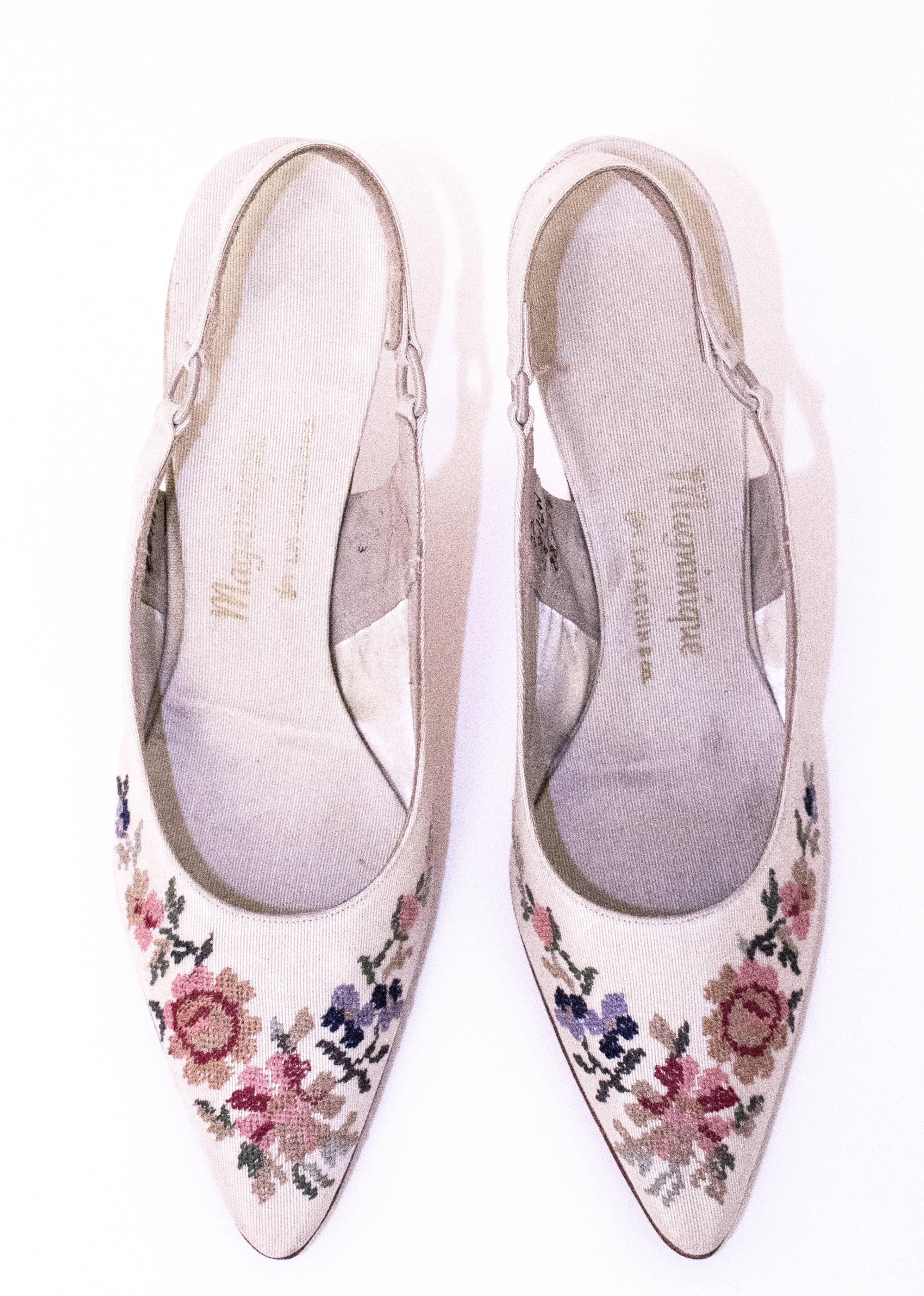 60s Cream Slingback Heels with Floral Needlepoint Embroidery. Leather soles. Headstock condition.  

Measurements:
Insole: 10 1/4