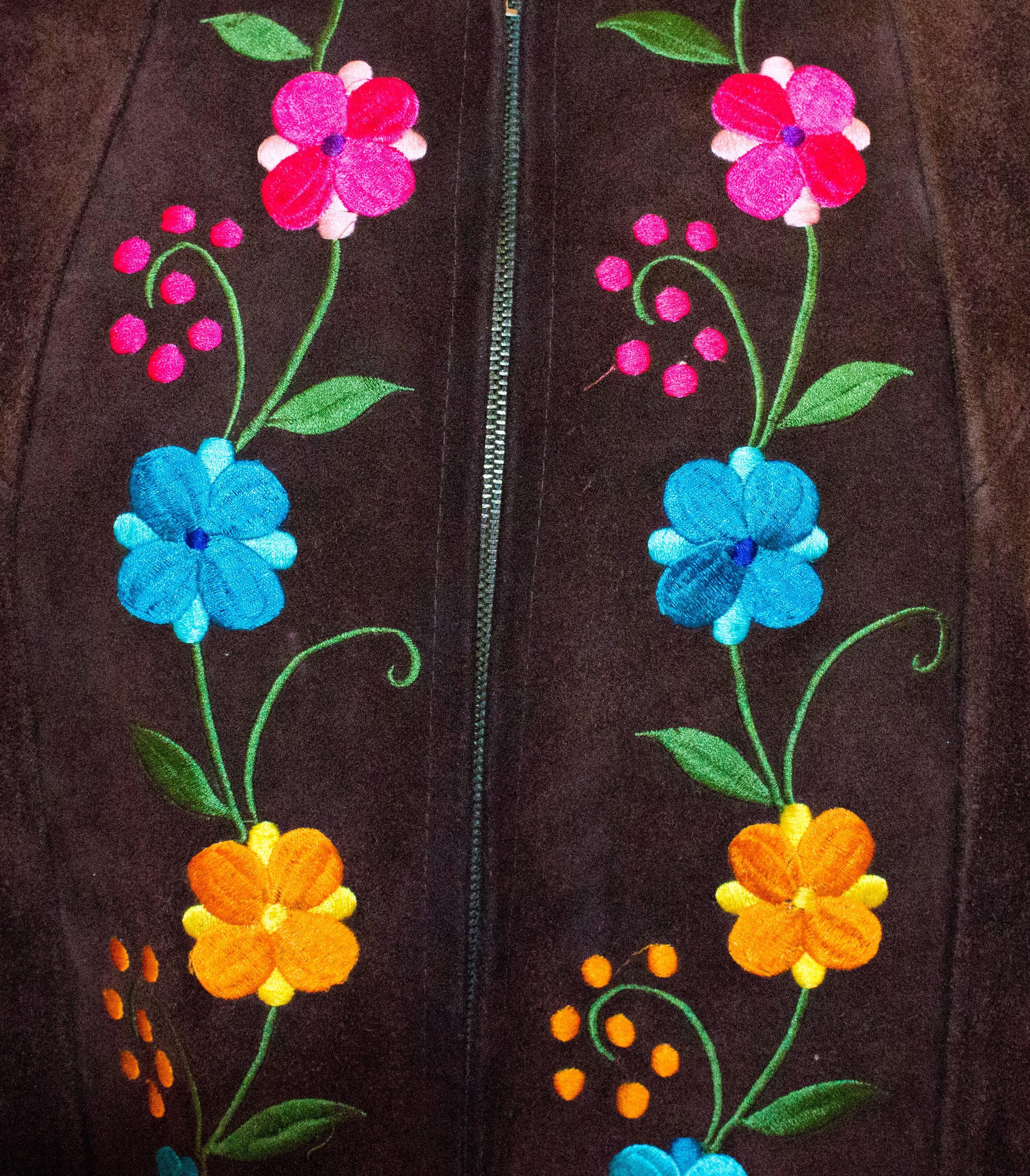 70s Suede Cape with Embroidered Flowers. Metal zipper up the front. 

