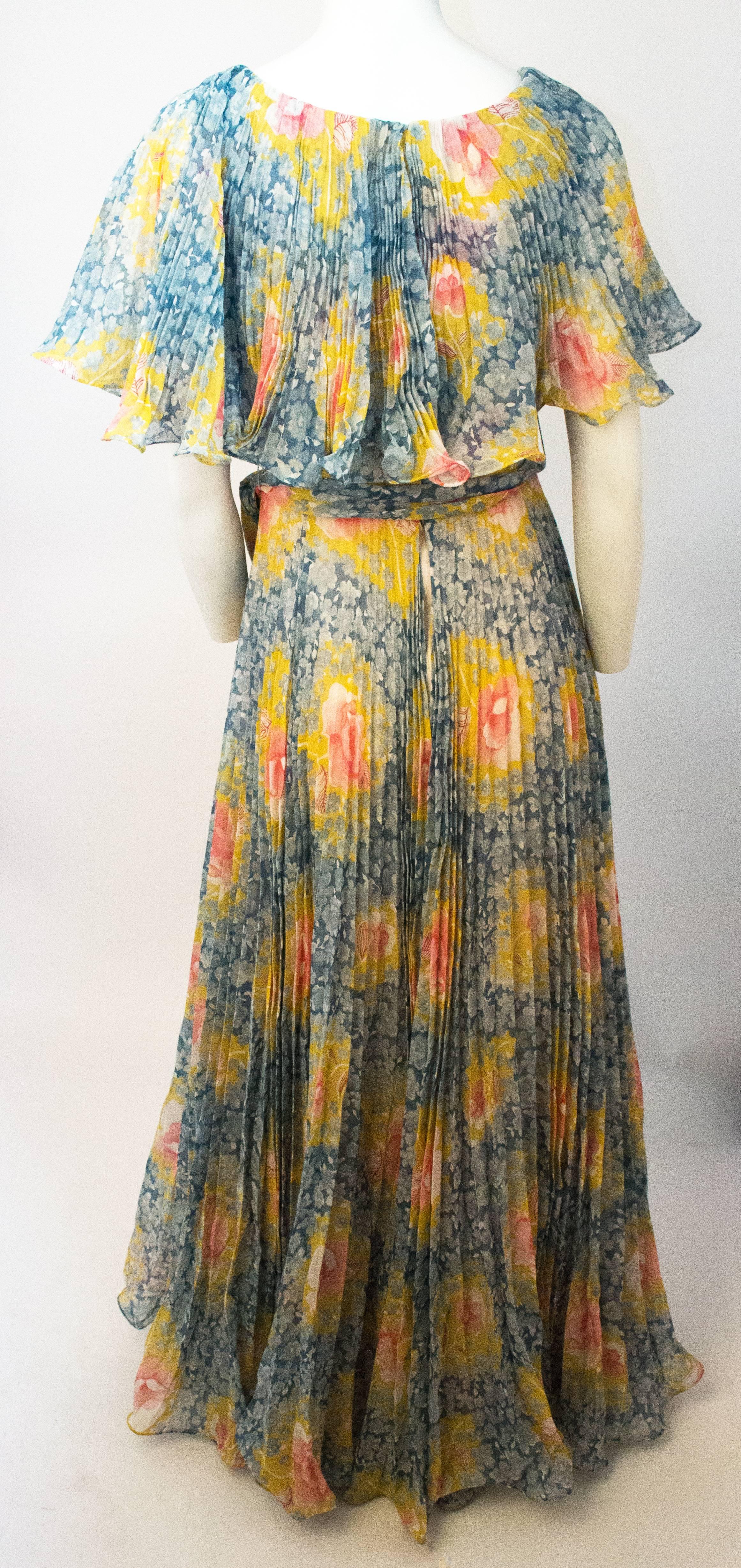 70s Floral I.Magnin & Co. Maxi Dress. Original waist sash. Fully lined. Zips up the back. 