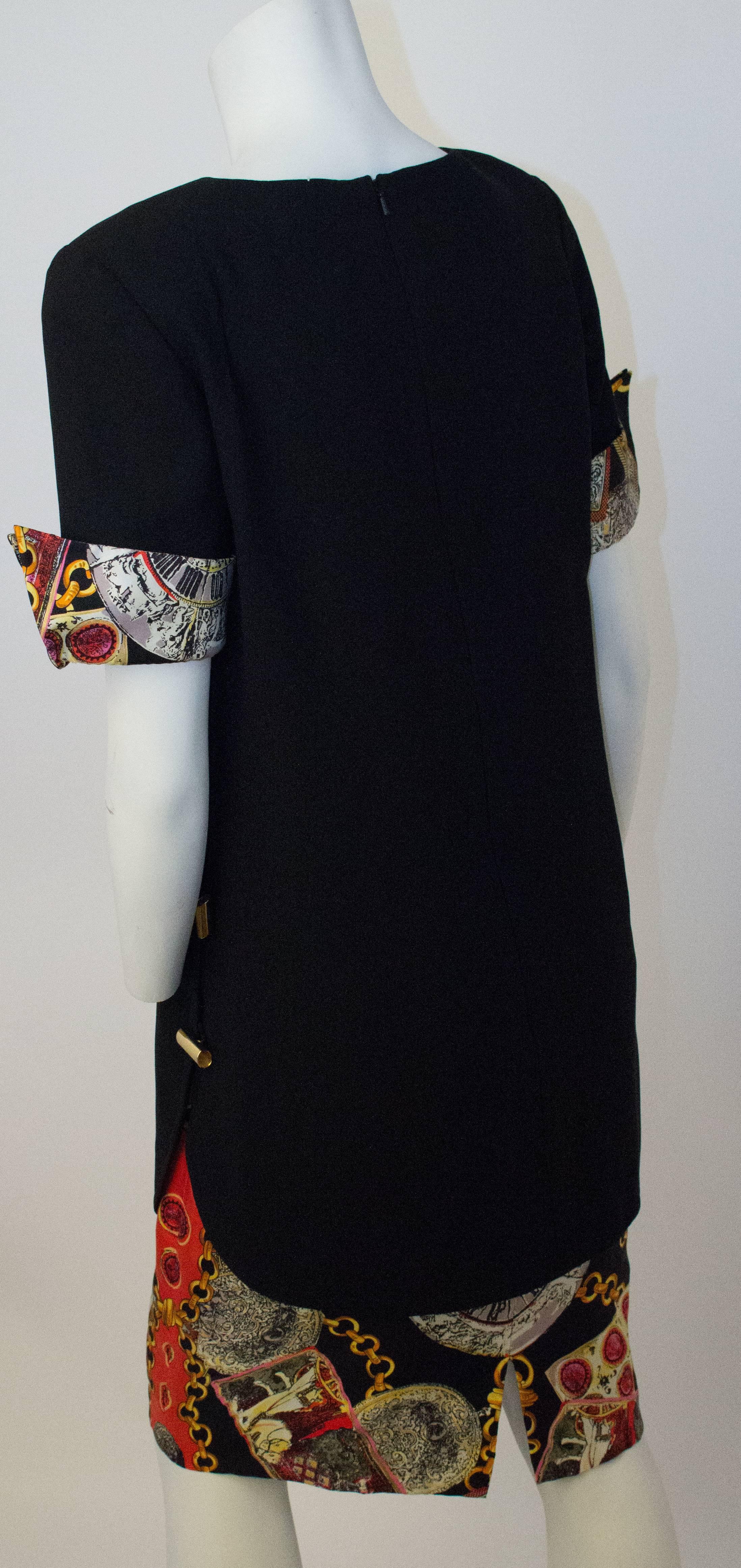 80s Bill Blass Shift Dress. Gold tone buttons along the side. Fully lined. Zips up the back. 
