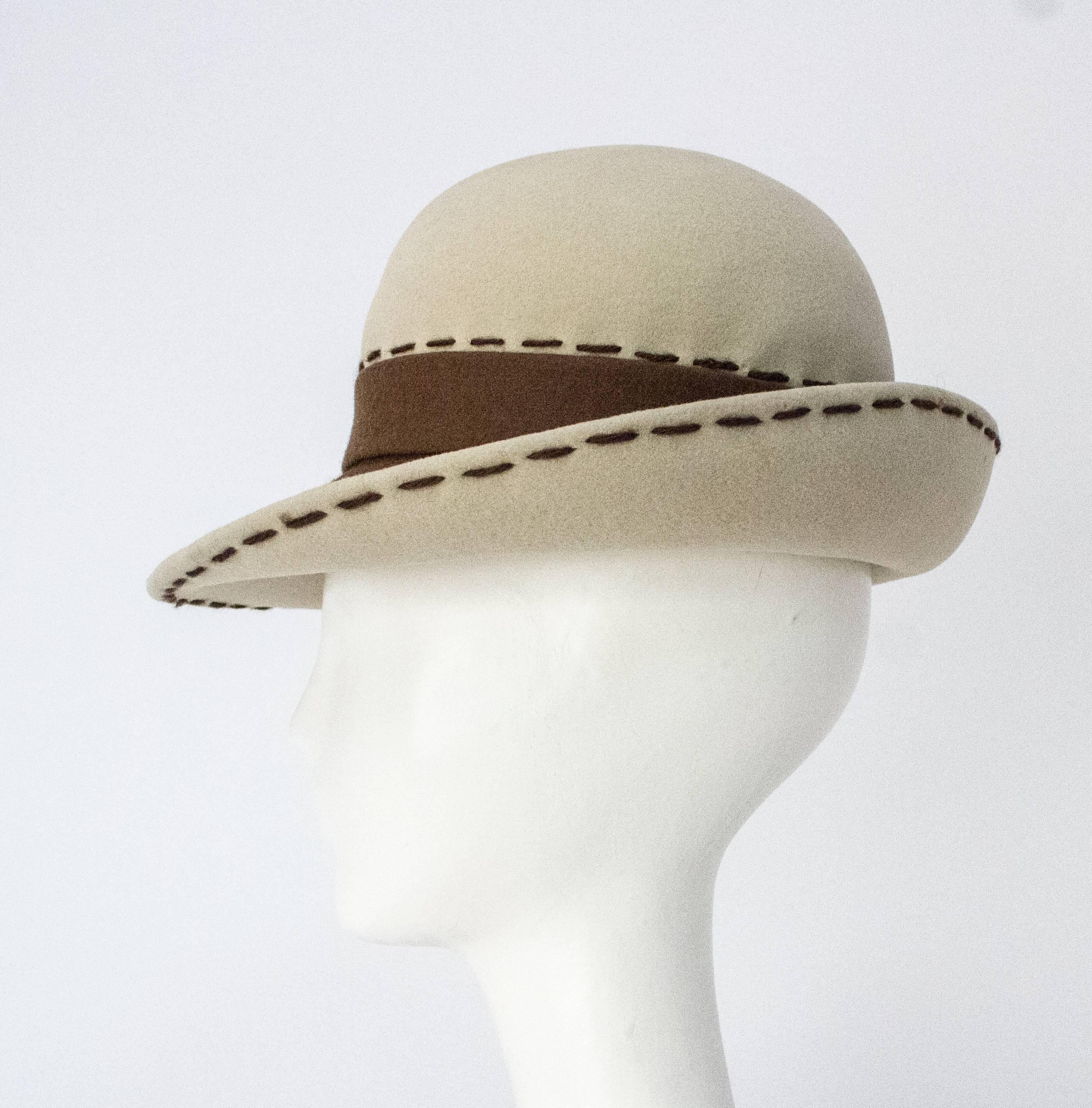 80s Brown and Cream Christian Dior Hat. Measures 20 1/4 inches around.