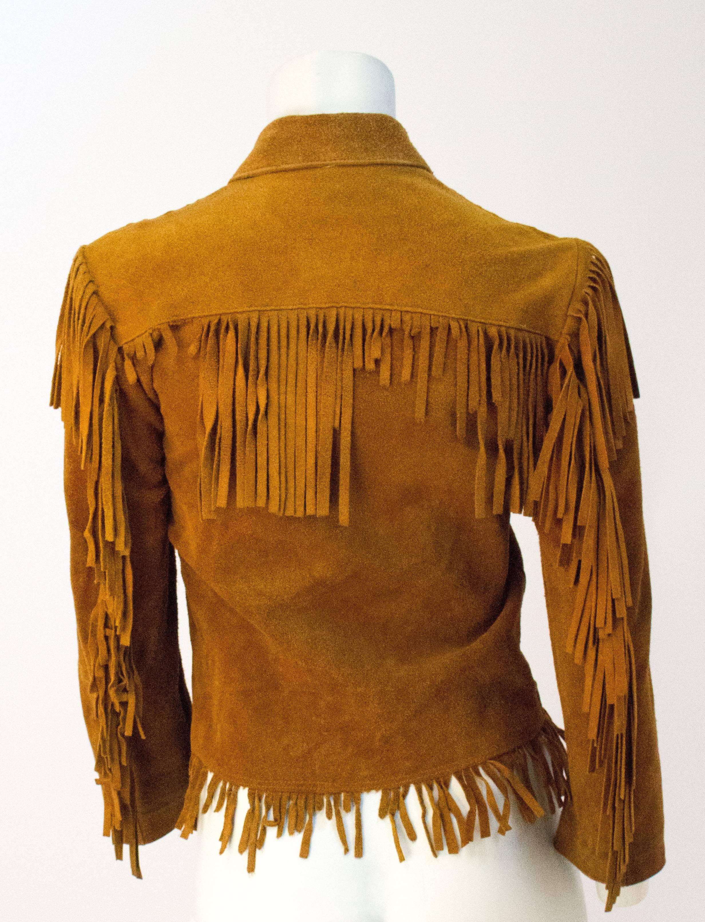 60s Small Suede Western Fringe Jacket. Snaps up the front. Two patch pockets. 