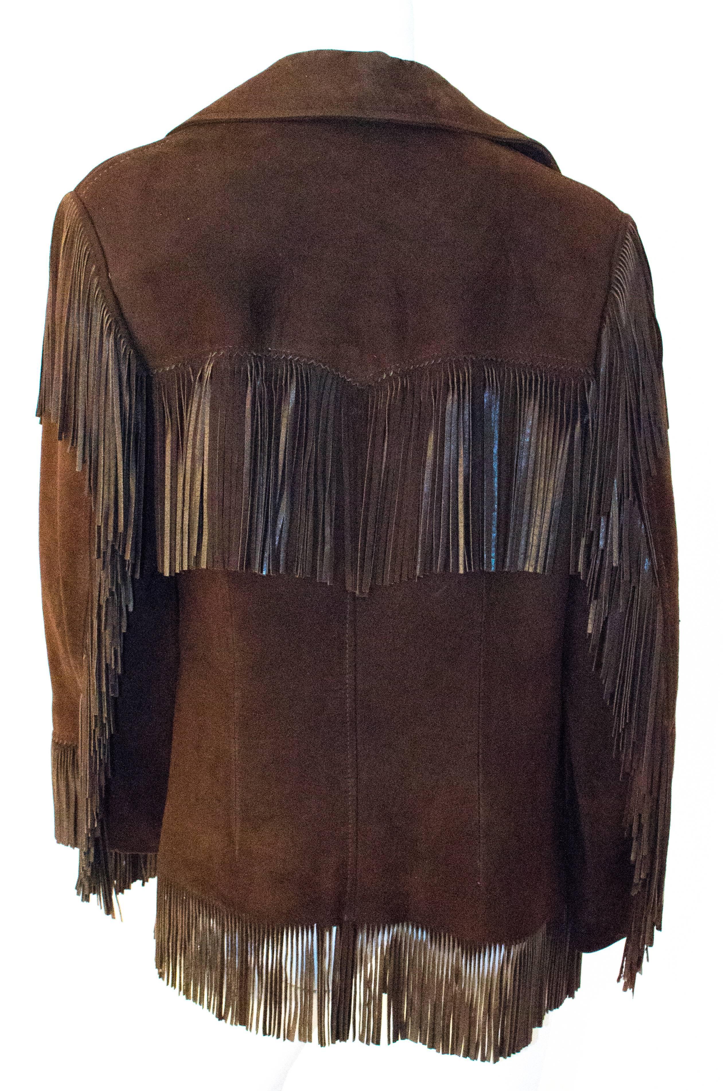 70s Dark Brown Suede Fringe Jacket. Two front pockets. Lined. 